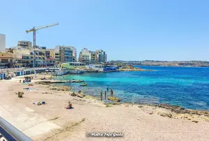 Local guide to Bugibba Perched Beach in Malta, covering the sand and swimming, facilities, lido, parking, buses, summer and winter, plus nearby hotels.