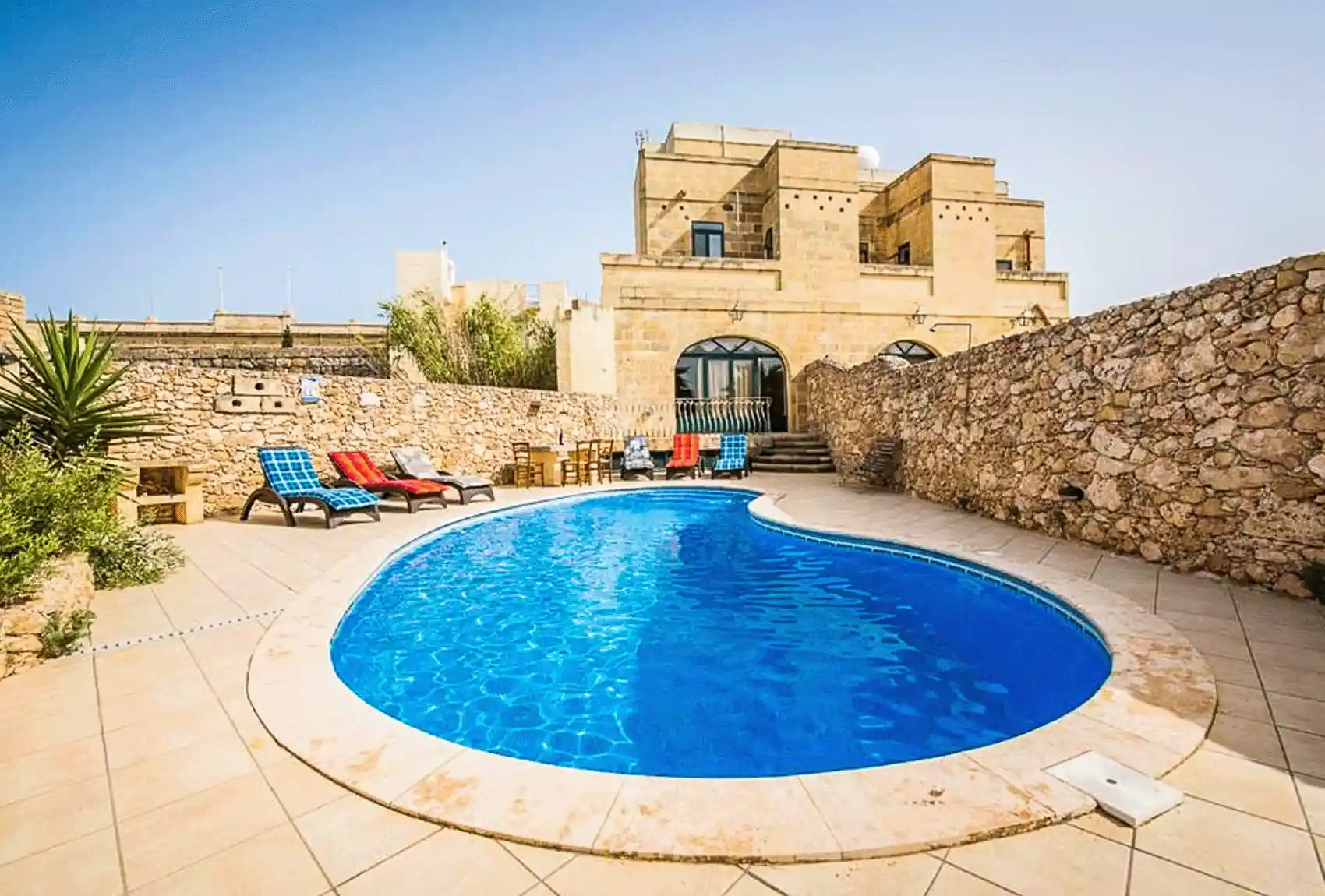 Holiday Farmhouse, Nadur, Gozo, Malta, spacious private pool courtyard with sunbathing area.