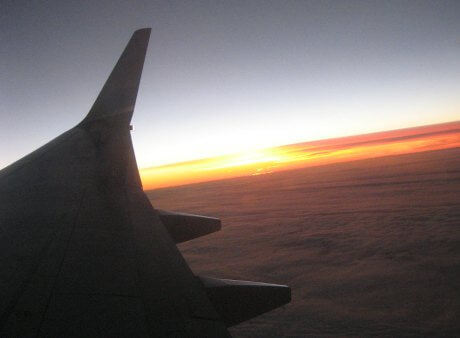 AirMalta plane flying at sunset