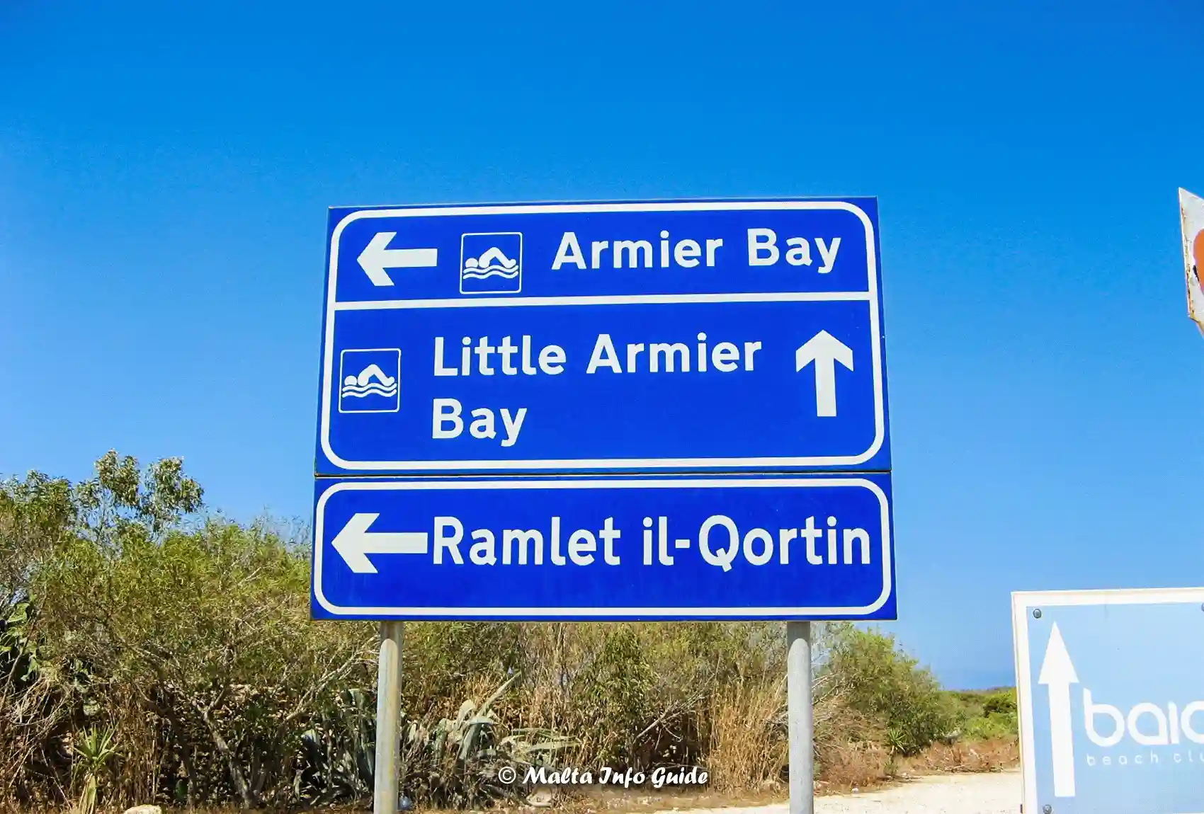 Road signs pointing toward Armier and Little Armier.