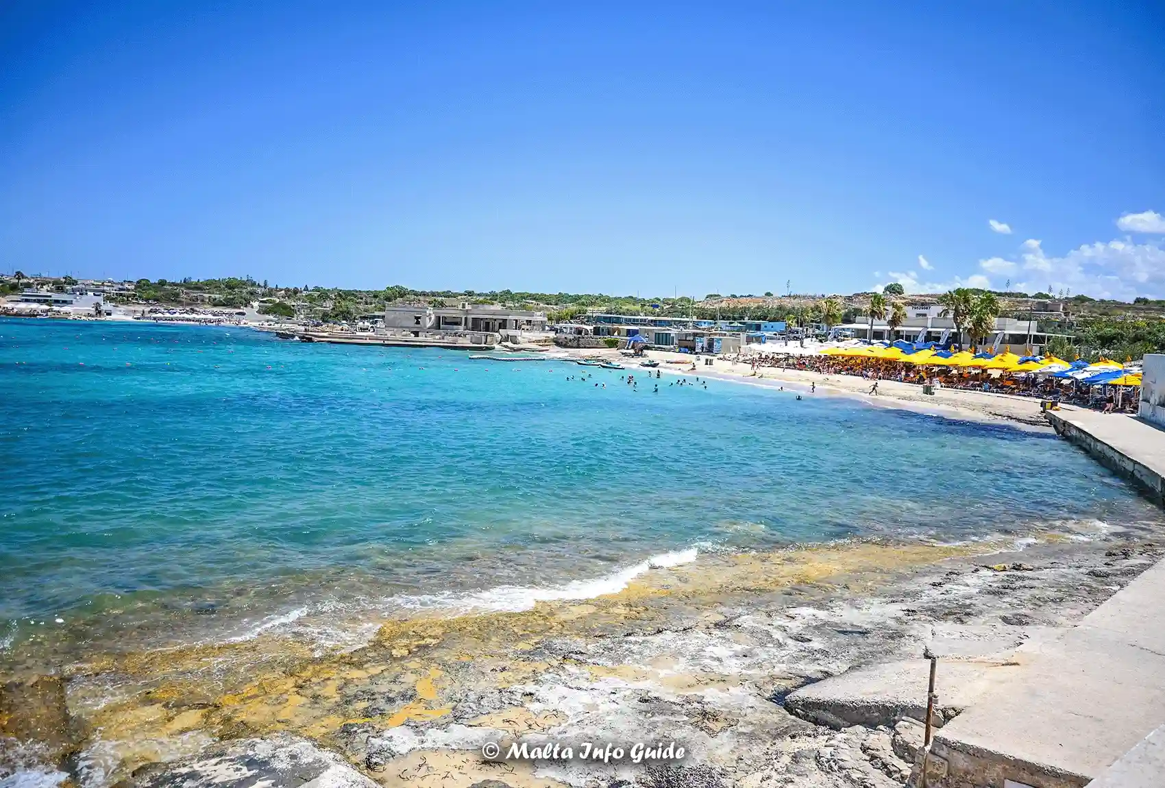 Wide coastal view across the waters of Armier Bay.