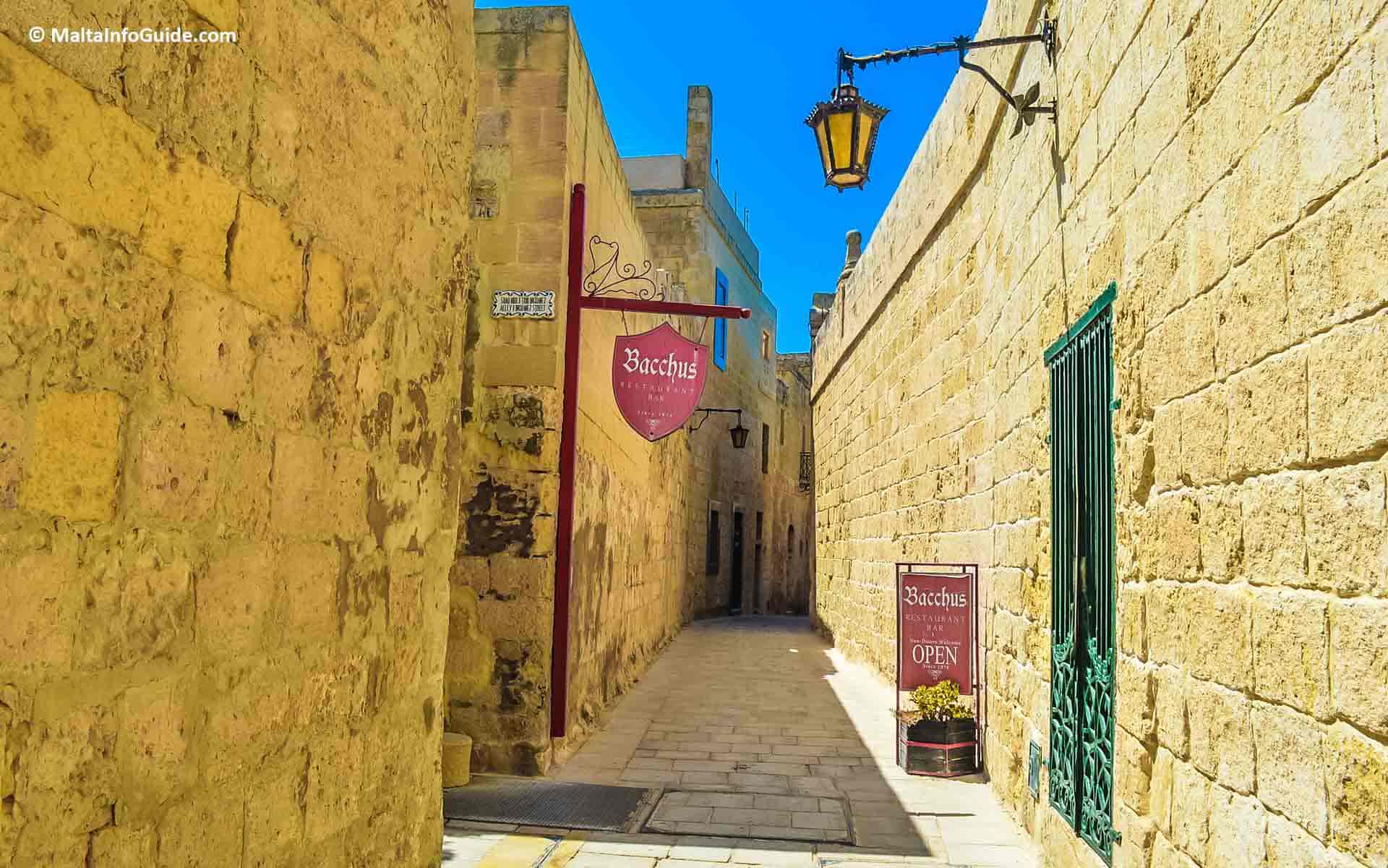 The Bacchus restaurant sign in one of Mdina's narrow streets.
