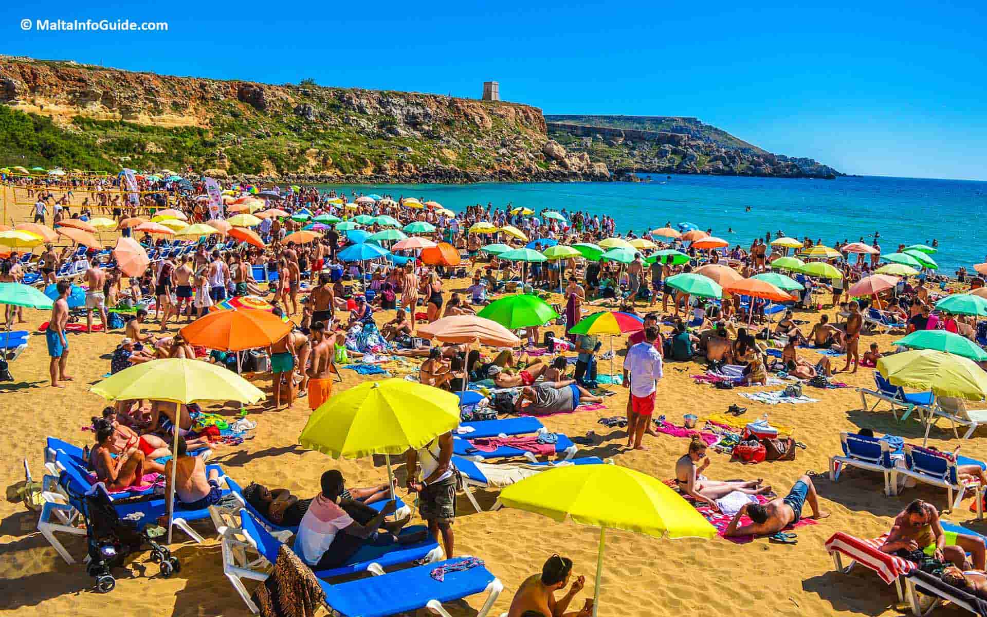 People sunbathing at Golden bay Malta.