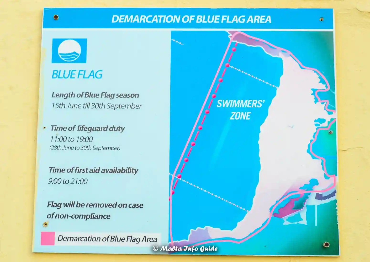 Blue Flag sign showing designated swimmers zone and times.