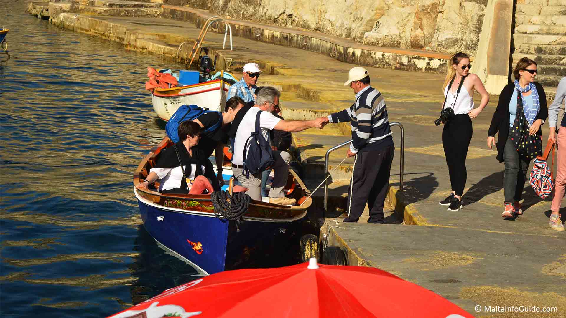 Tourists disembarking the boat after a trip to the caves
