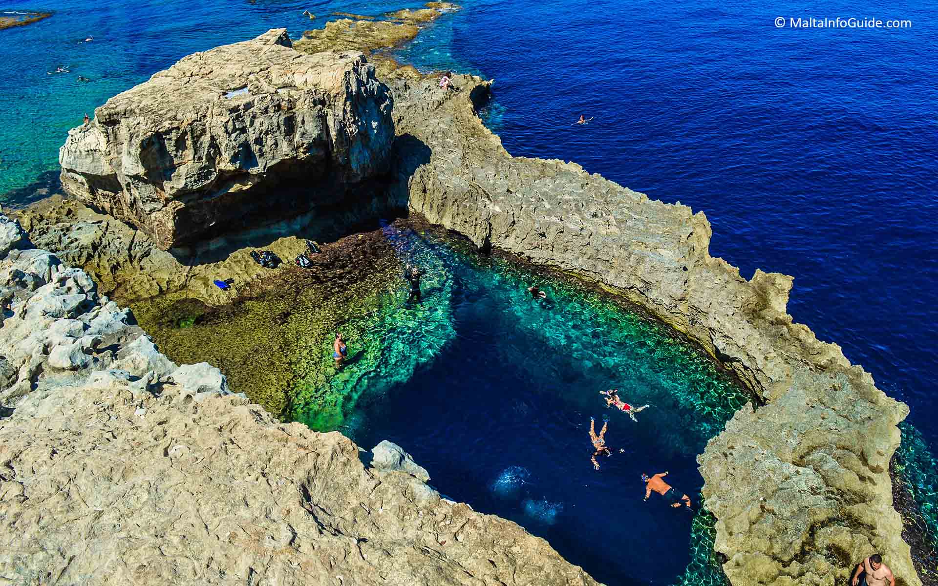 People swimming in the Blue Hole Malta Gozo.
