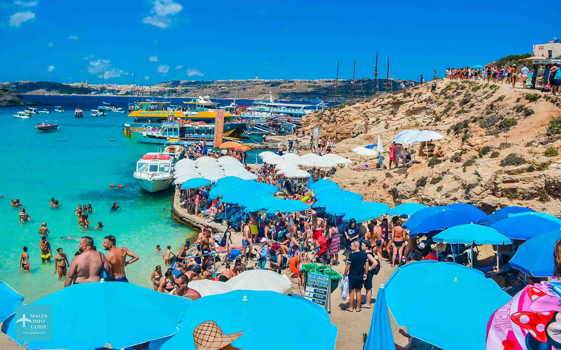 People sunbathing at Blue Lagoon Comino