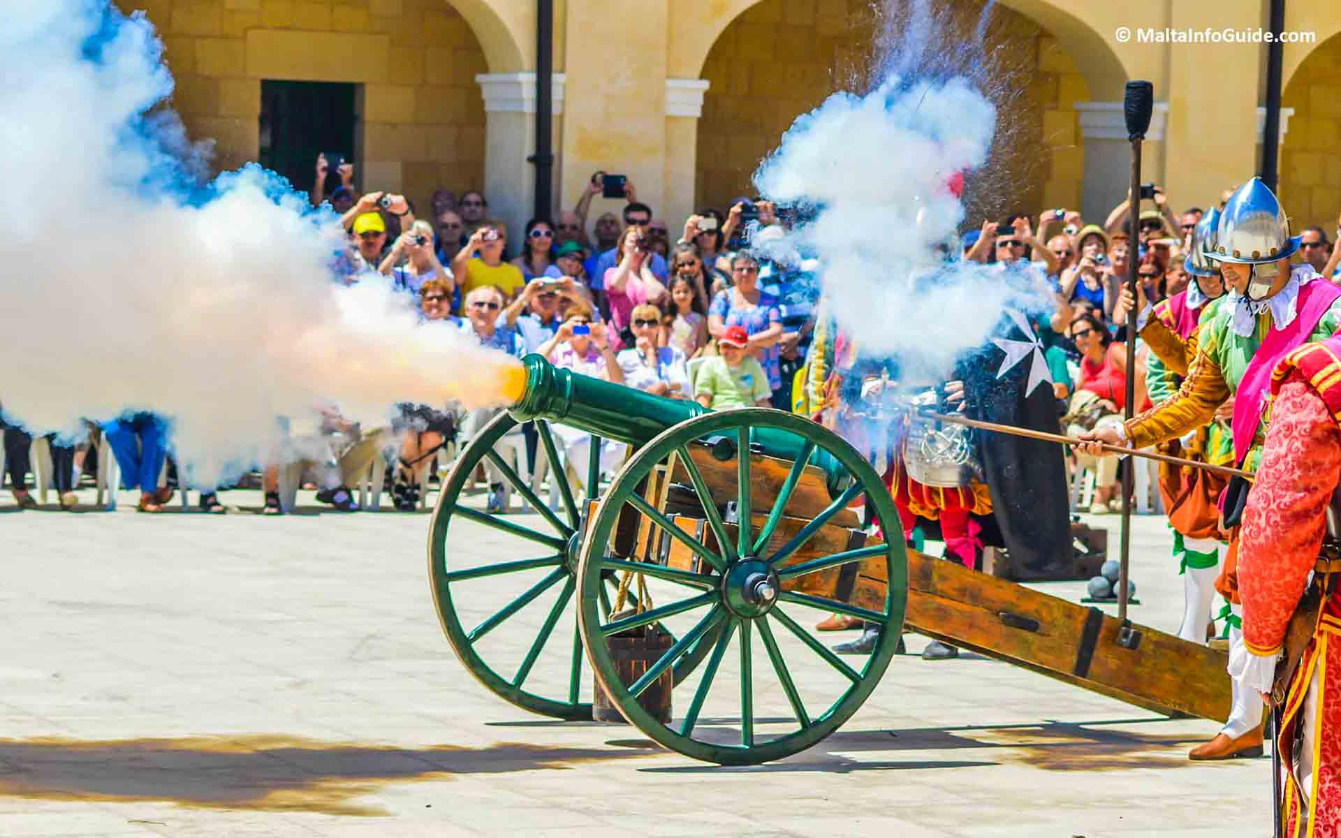 A large cannon being fired during the parade. A large cannon being fired during the parade.