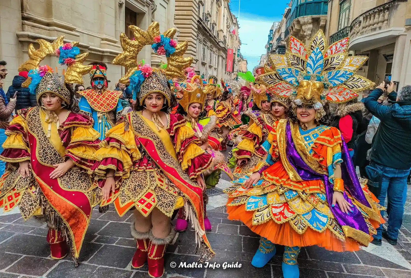Women walking republic street in Valletta dressed up in custom-made costumes. Women in Valletta dressed up for Carnival.