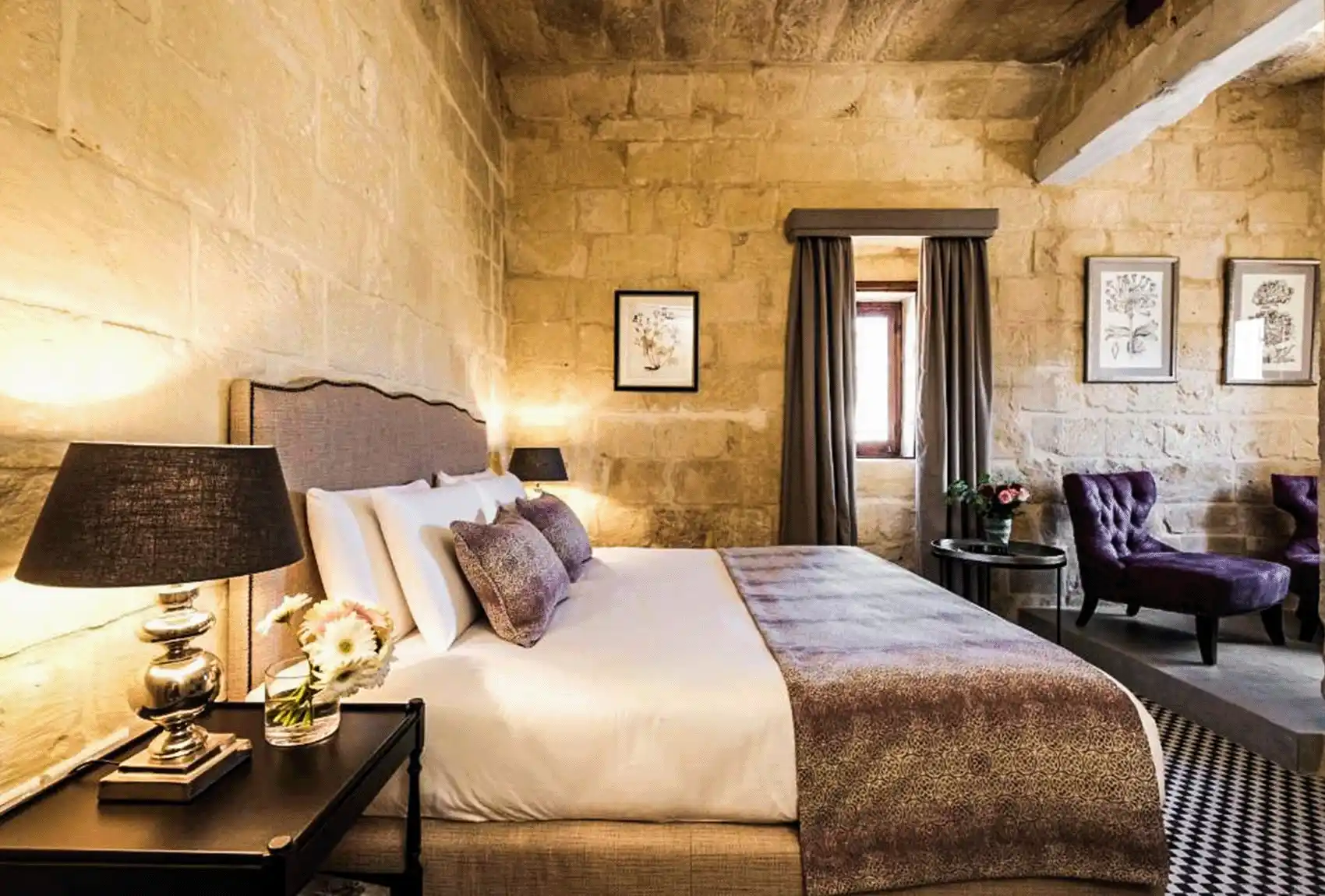 A character-filled bedroom at Cesca's Boutique Hotel Xlendi, Gozo, Malta.
