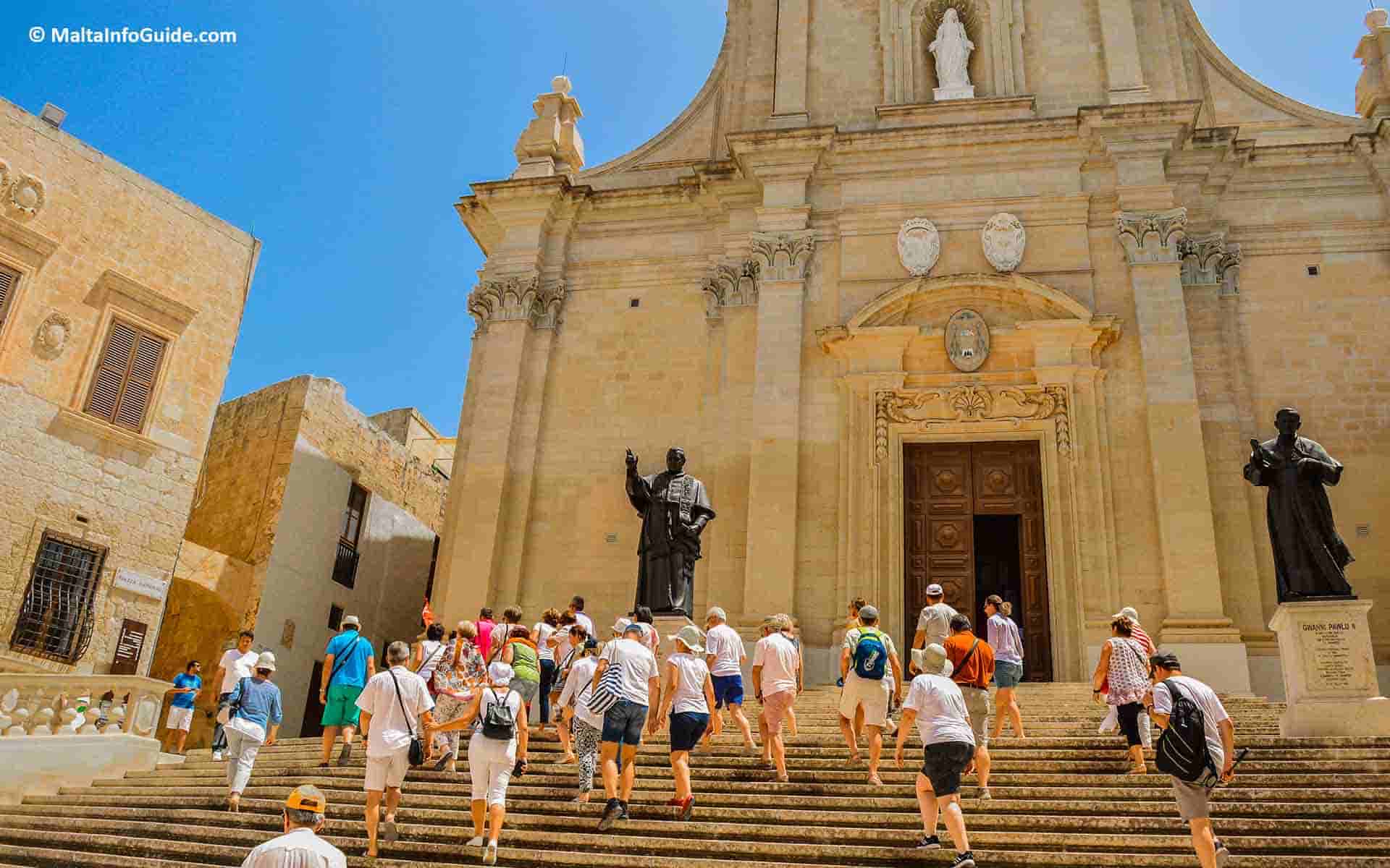 People walking up Citadel Gozo Malta.