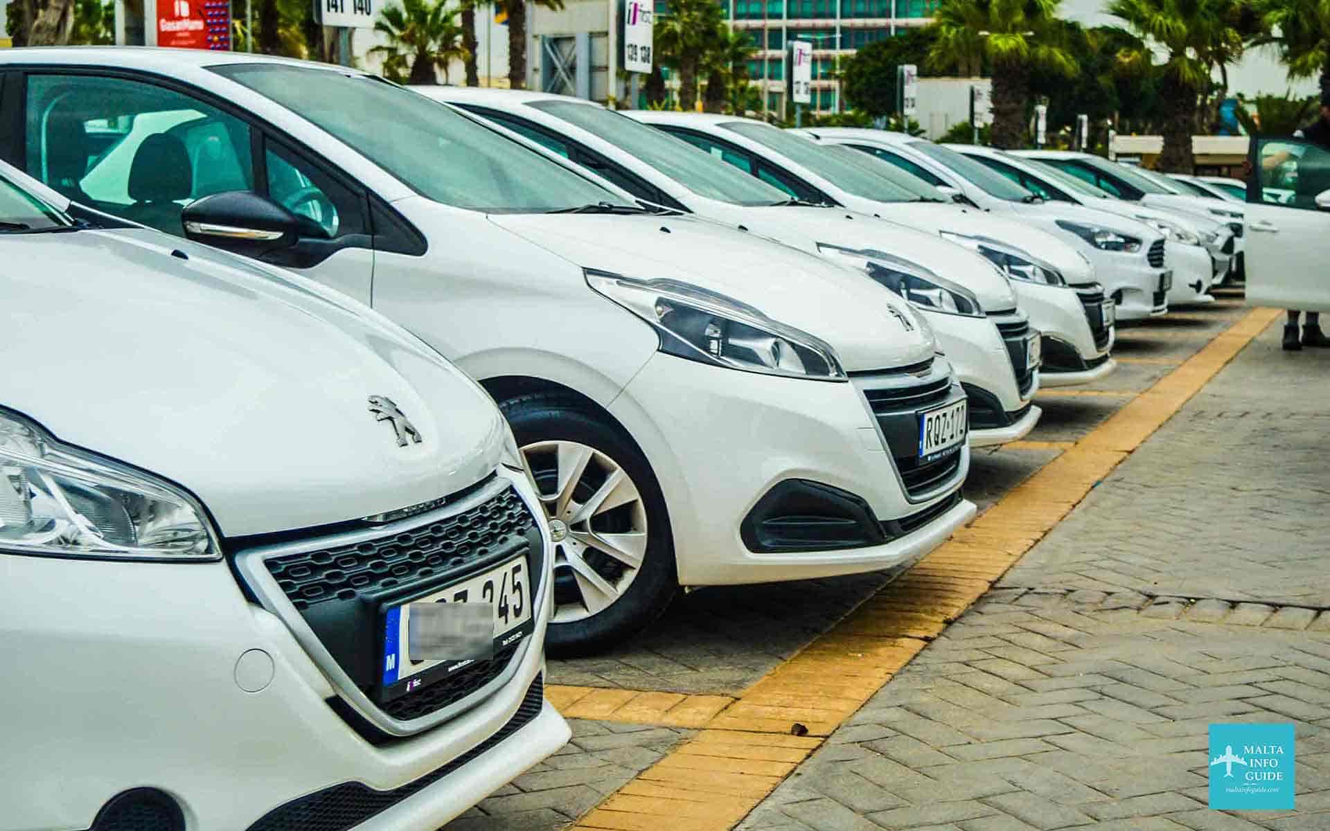 A selection of Peugeot car rentals parked at Malta International Airport.