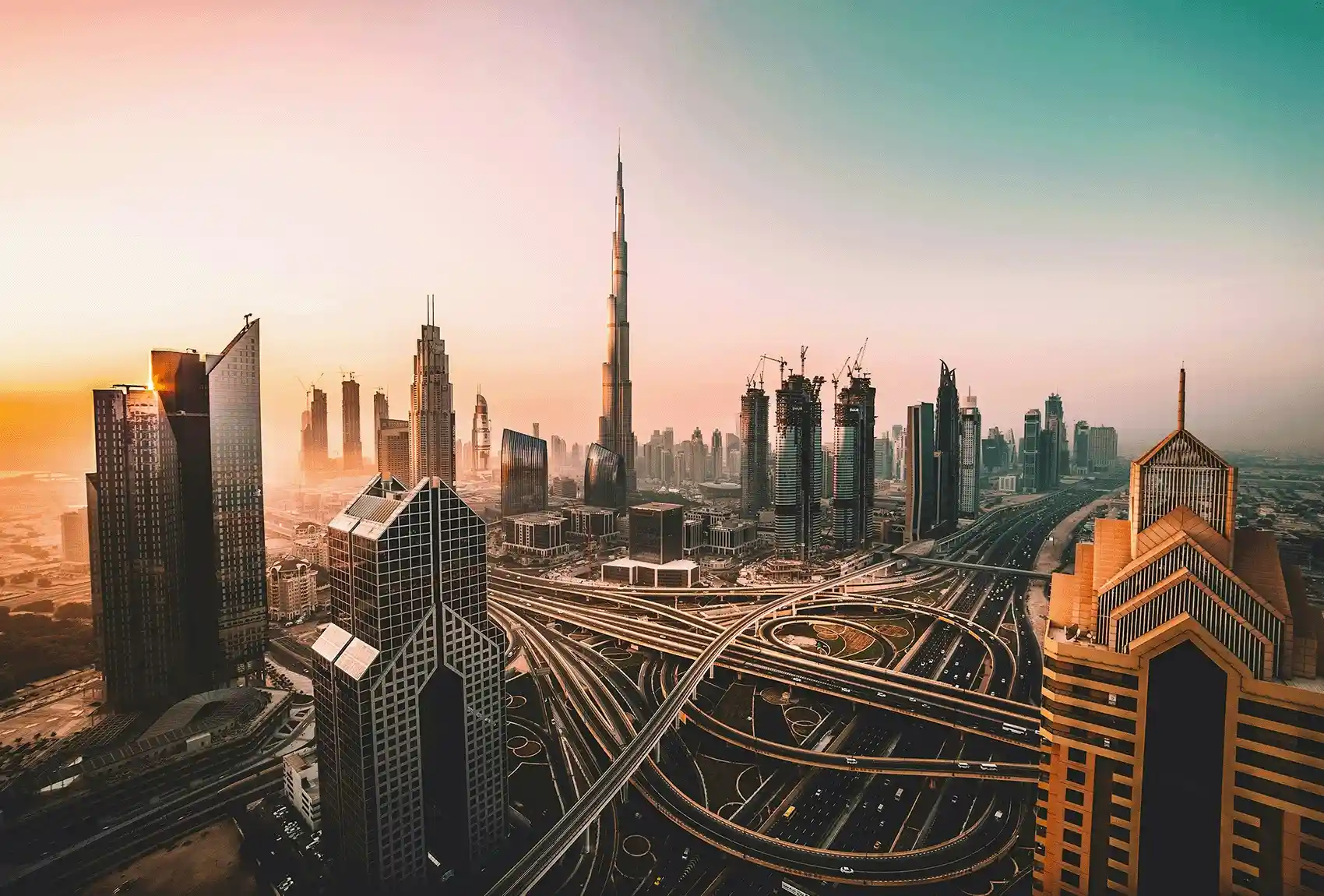 Dubai skyline with the Burj Khalifa at sunset.