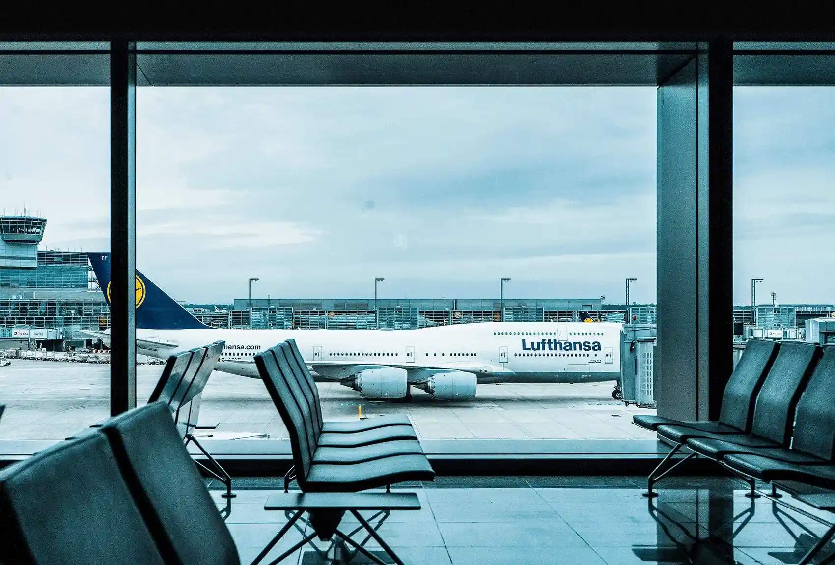 Lufthansa passenger plane viewed from an airport terminal.