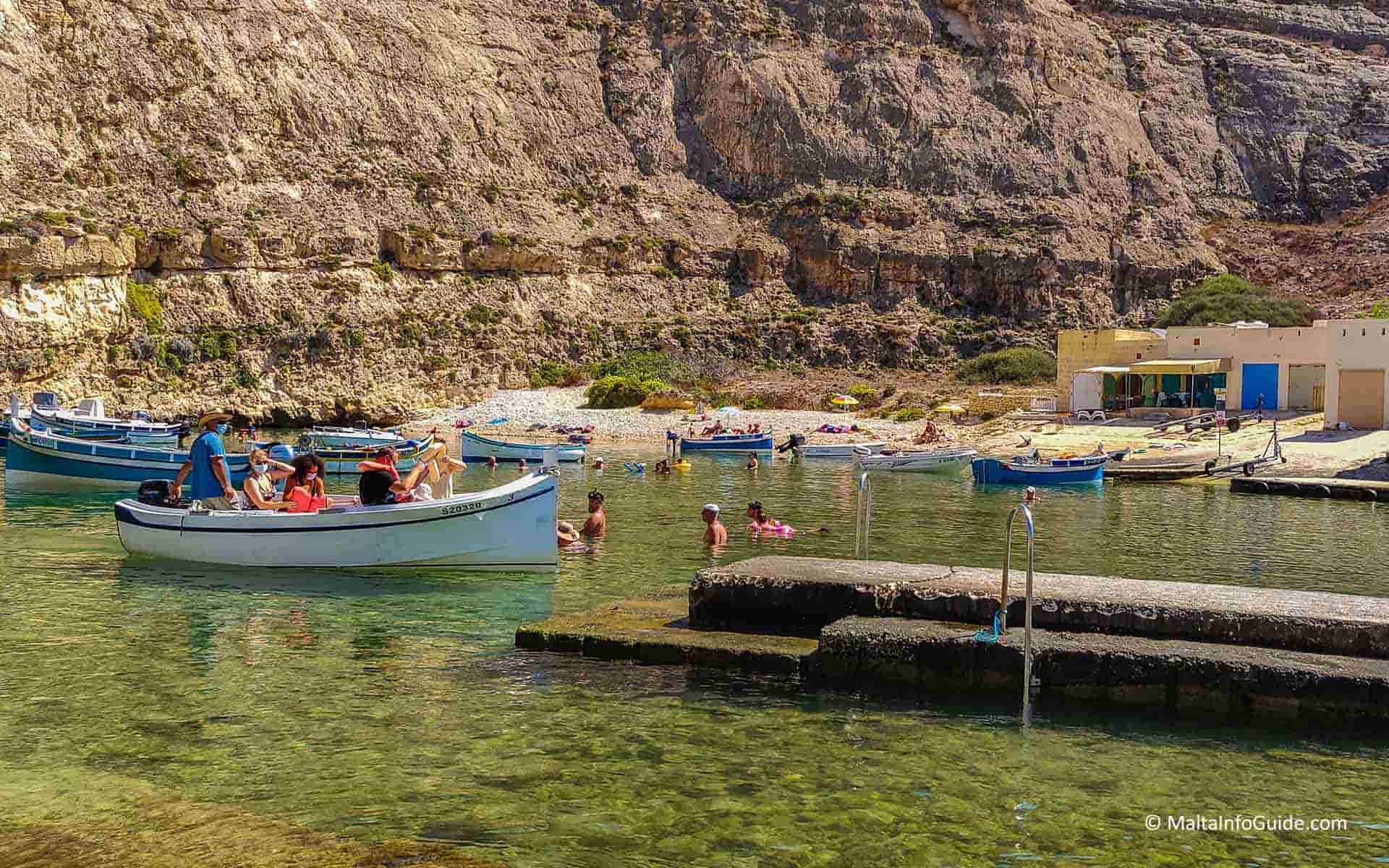 People disembarking the boat trip at Dwejra bay