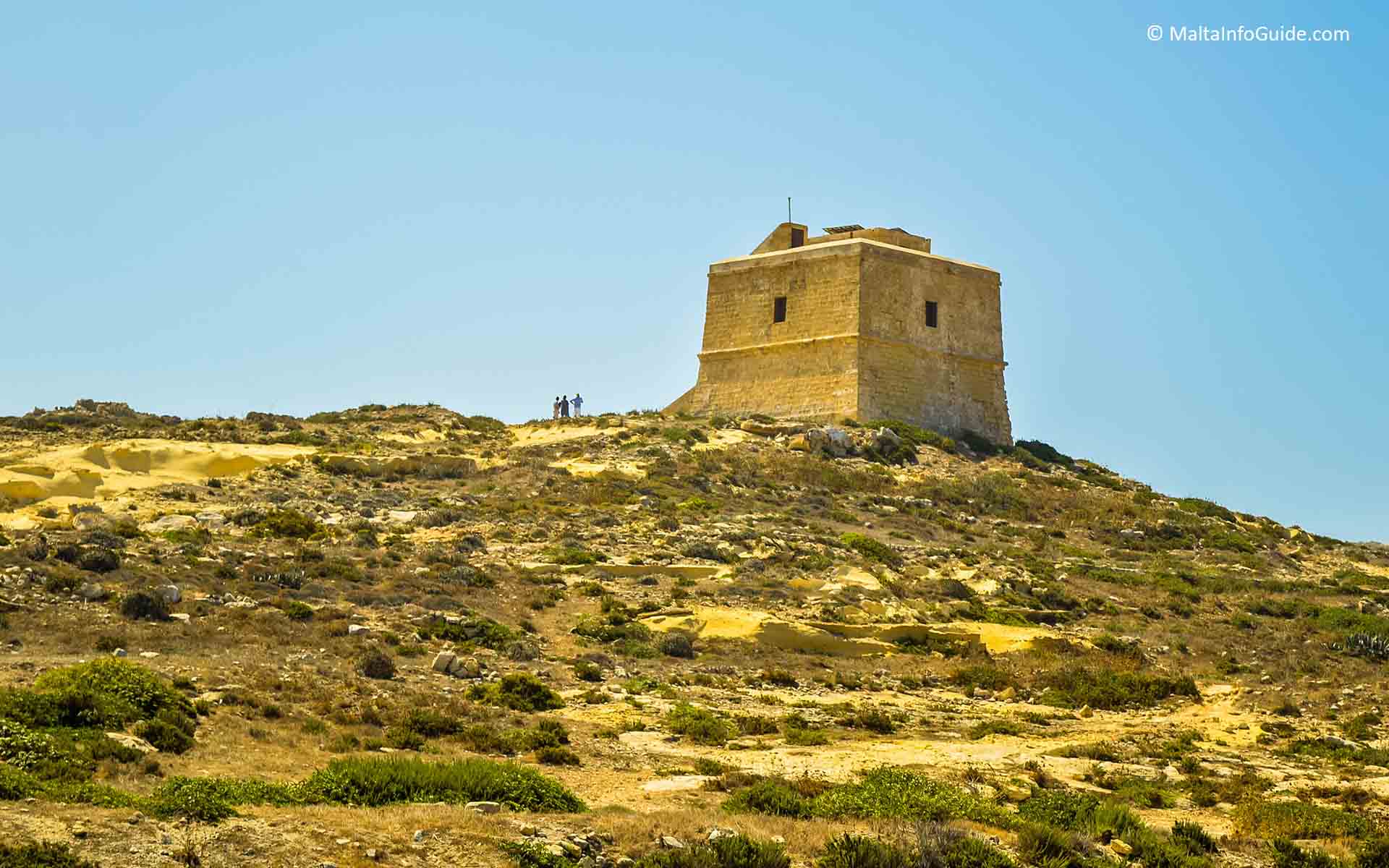 People standing close to the Dwejra tower.