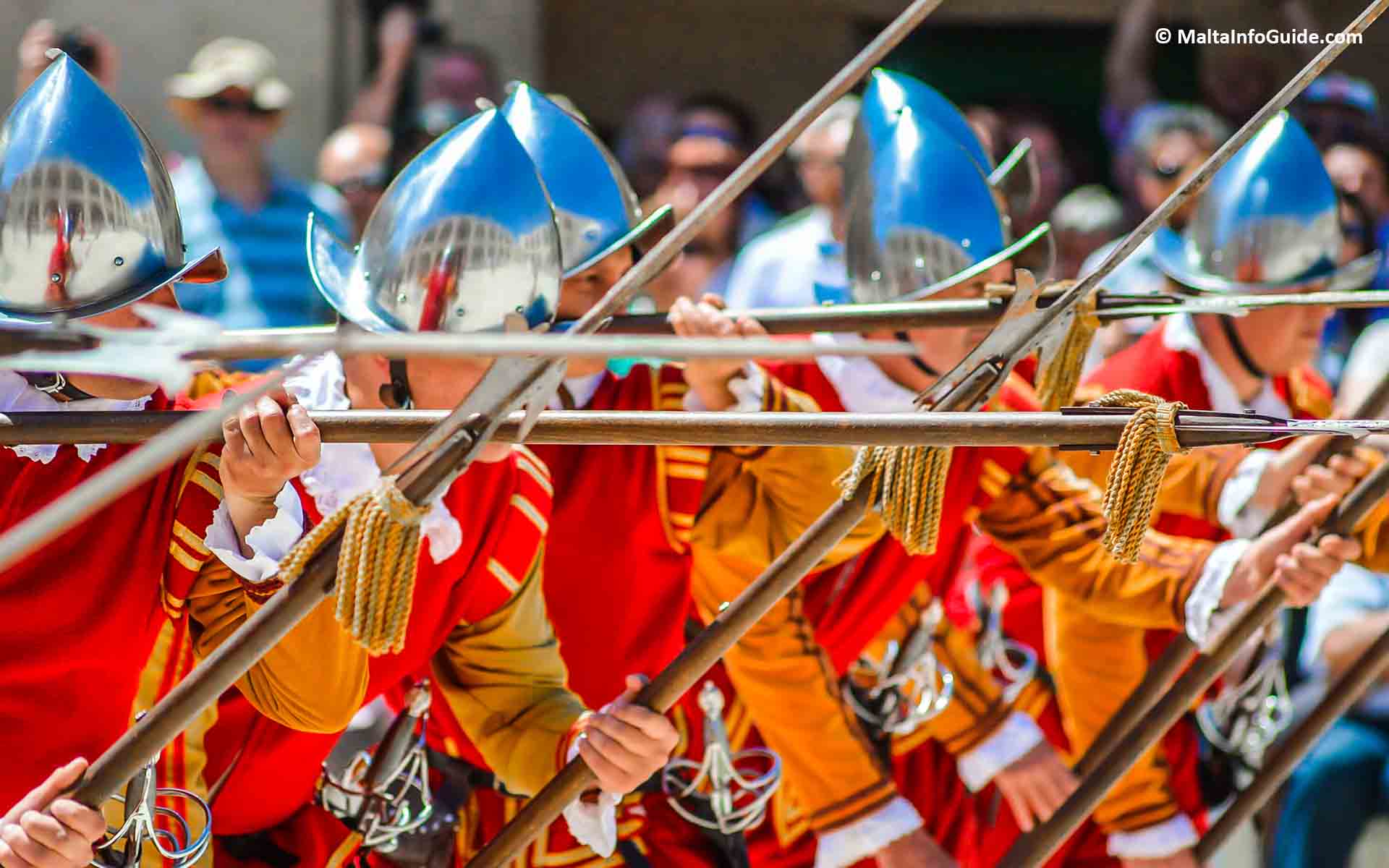Men dressed as knights during a parade. Men dressed as knights during a parade.