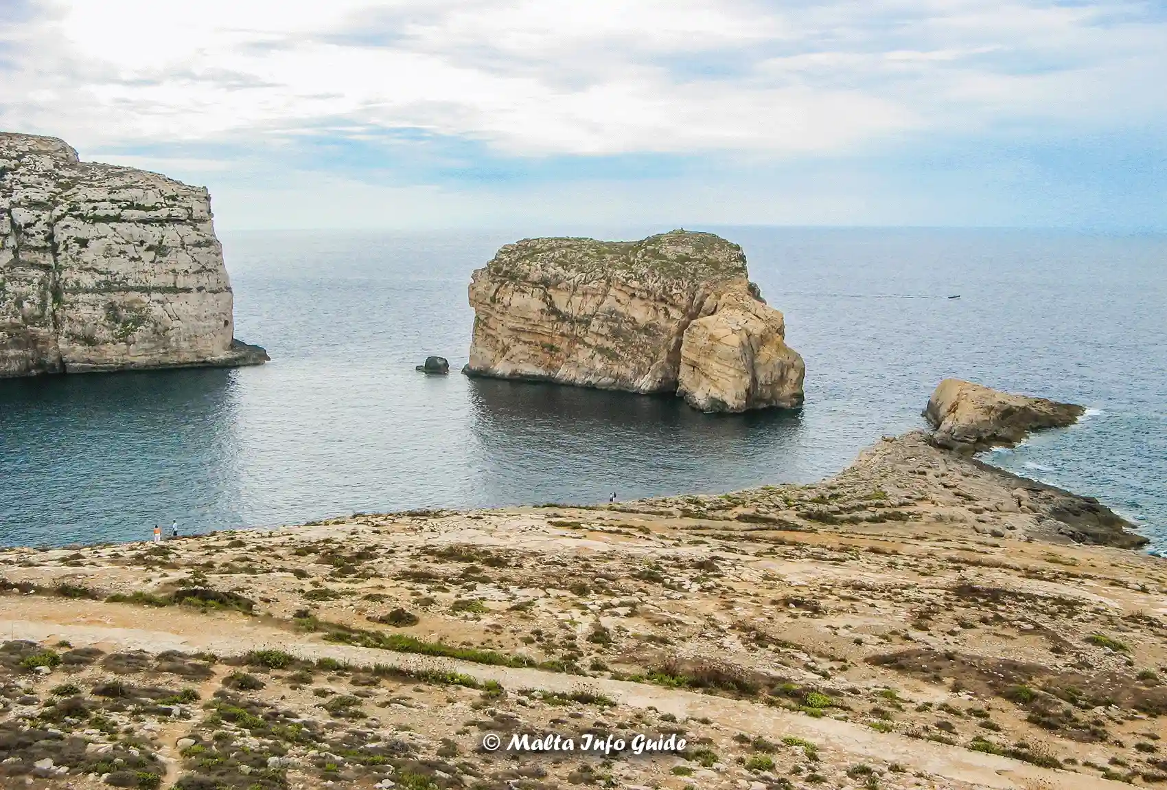View of Fungus Rock Gozo with high cliffs and calm sea in Gozo Island.