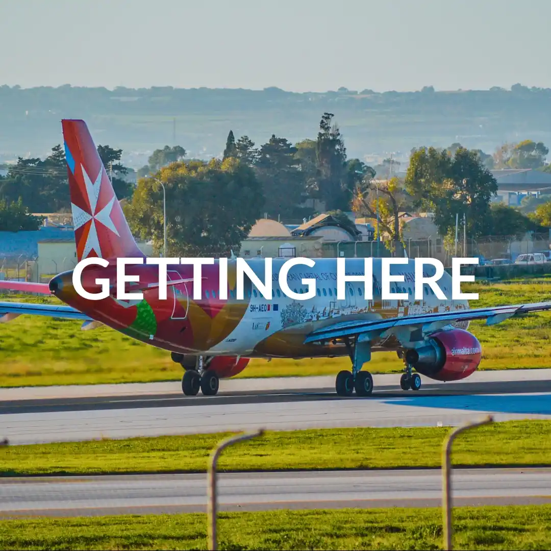 Airplane landing on the runway at Malta International Airport.
