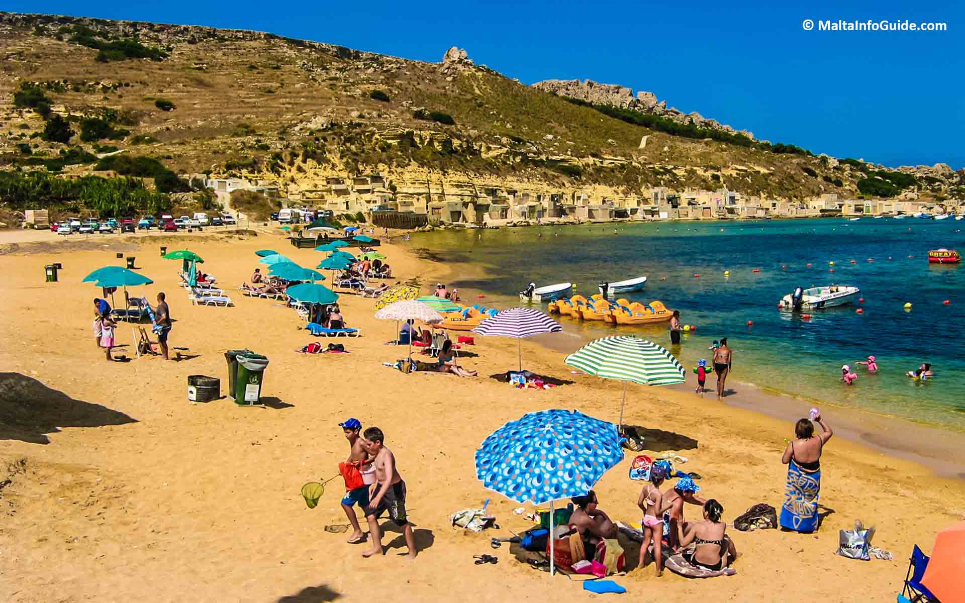 Gnejna Bay, on Malta's western coast, is home to an immaculate sandy beach surrounded by rocky cliffs, providing guests with a tranquil haven amid the splendour of the Mediterranean shore. Gnejna Bay in Malta.