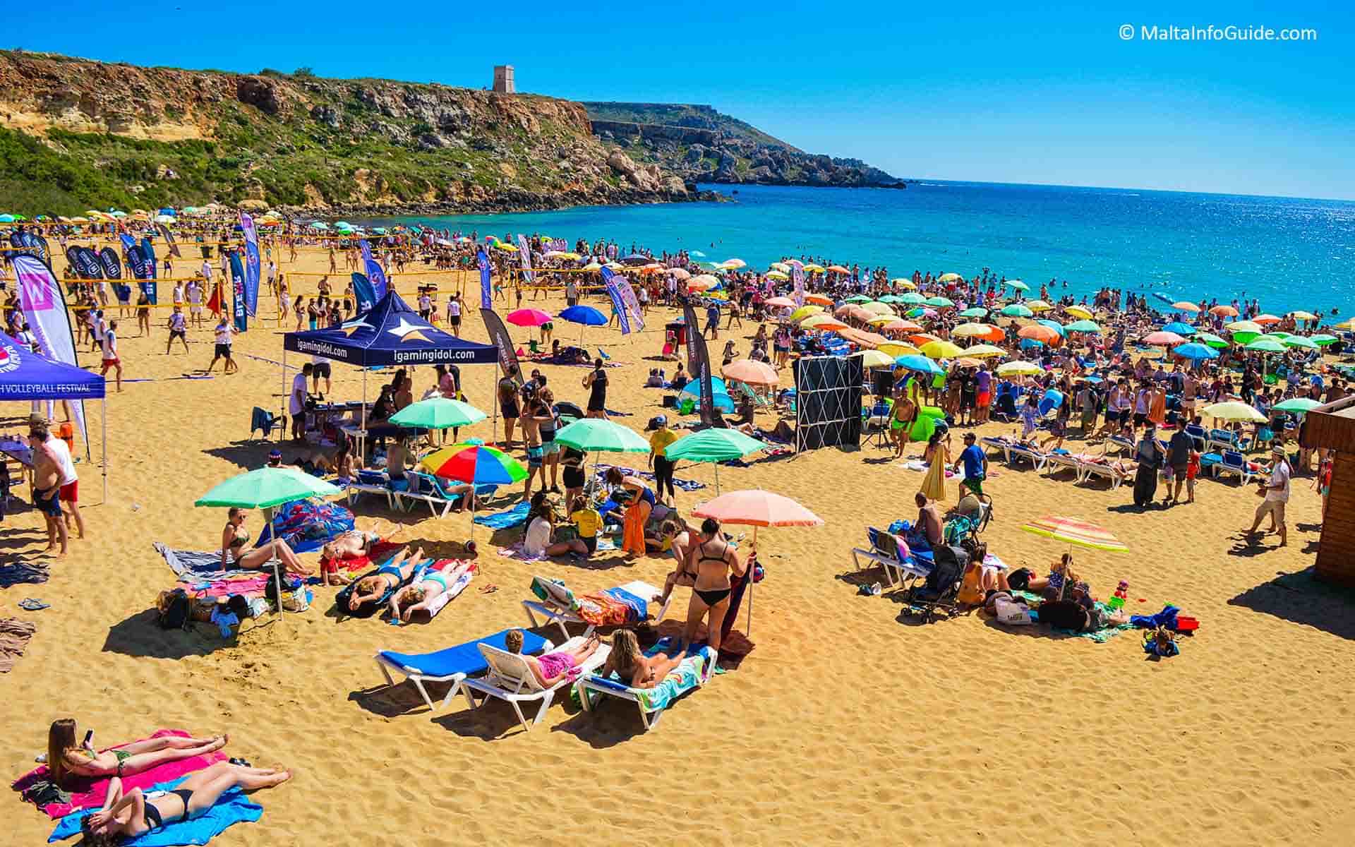 People sunbathing at Golden Bay Malta.