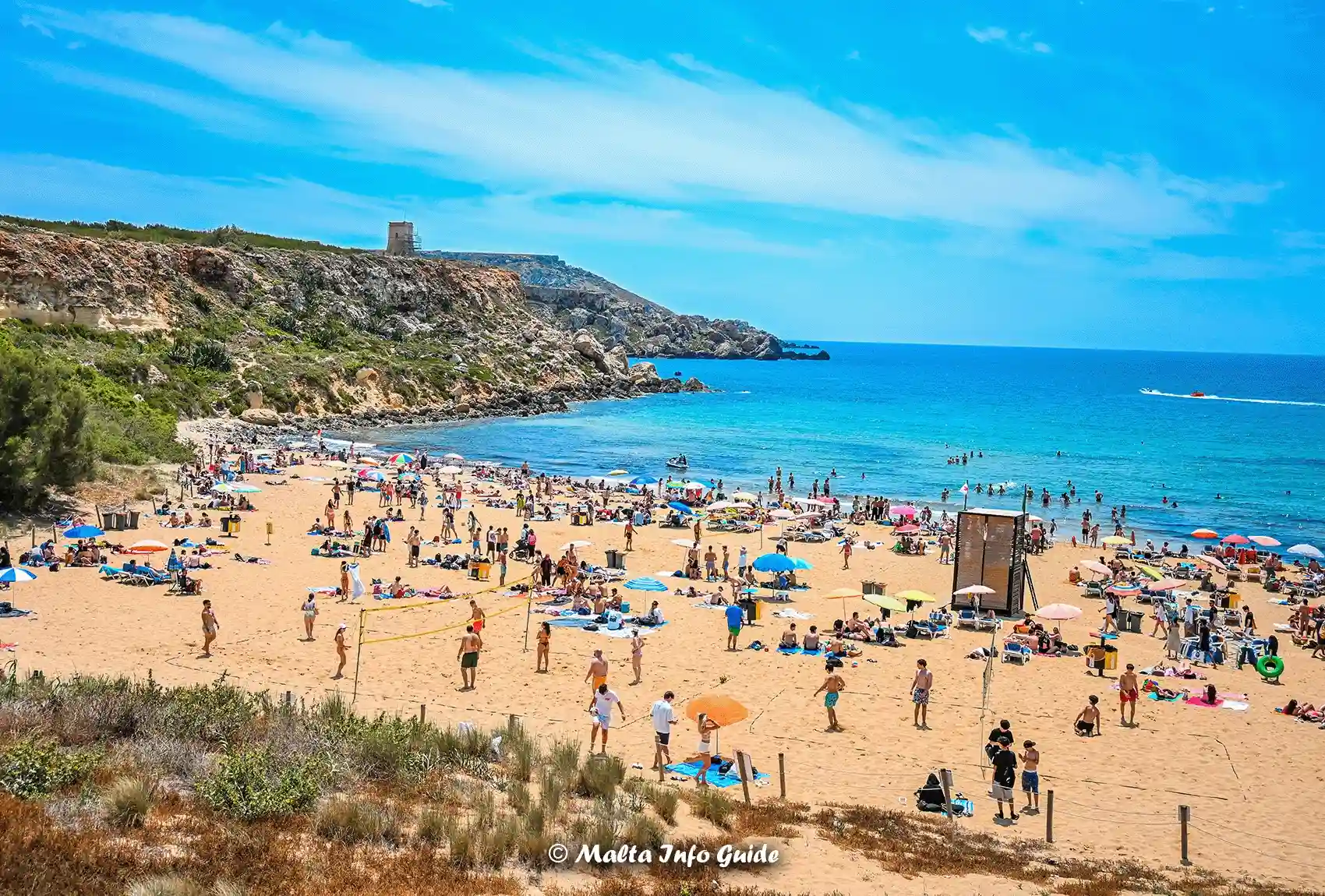 Visitors relaxing and swimming at sandy Golden Bay.