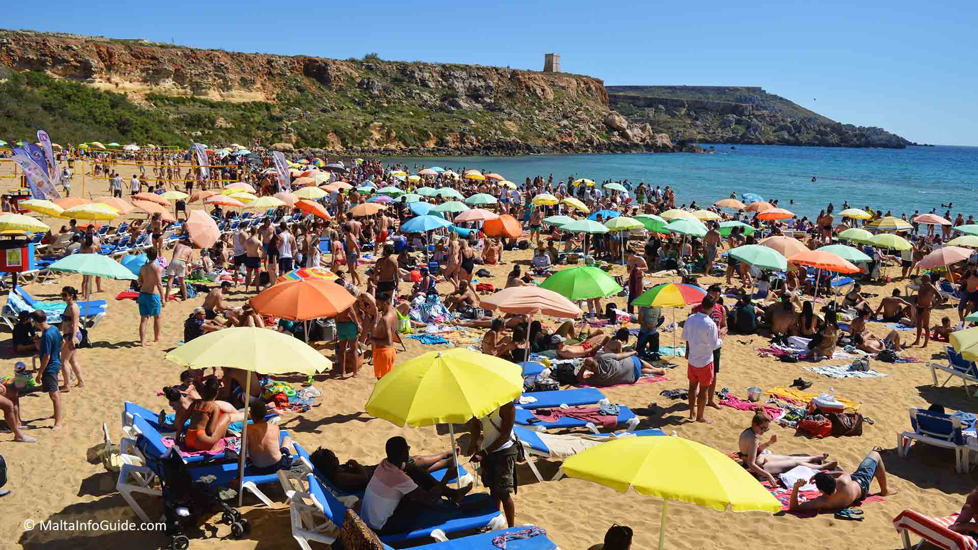 People sunbathing at Golden Bay. One of Malta's Blue flag beaches. People sunbathing at Golden Bay. One of Malta's Blue flag beaches.