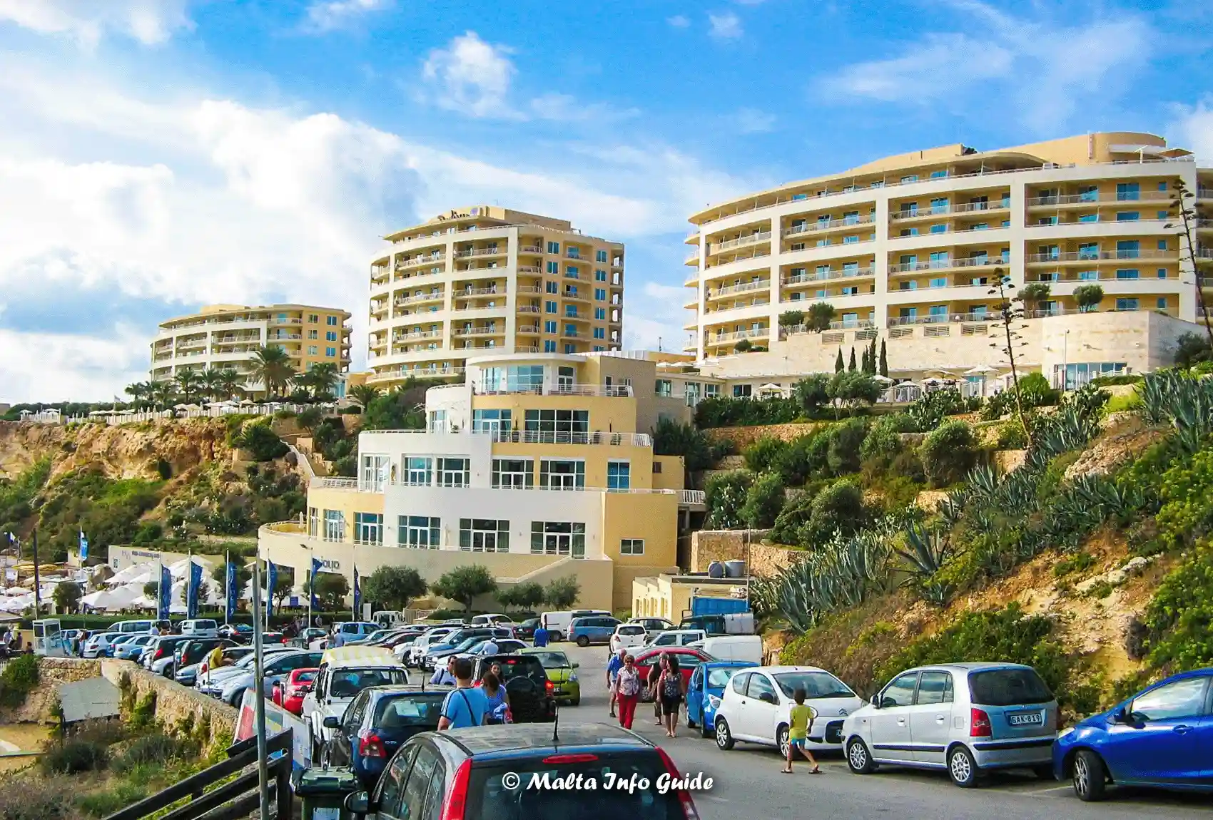 Parked cars below Radisson Blu at Golden Bay.