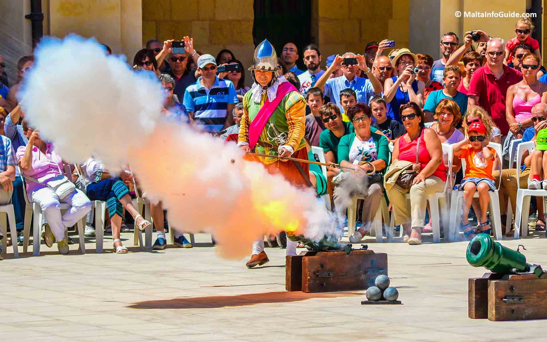 A small cannon being fired during the parade.