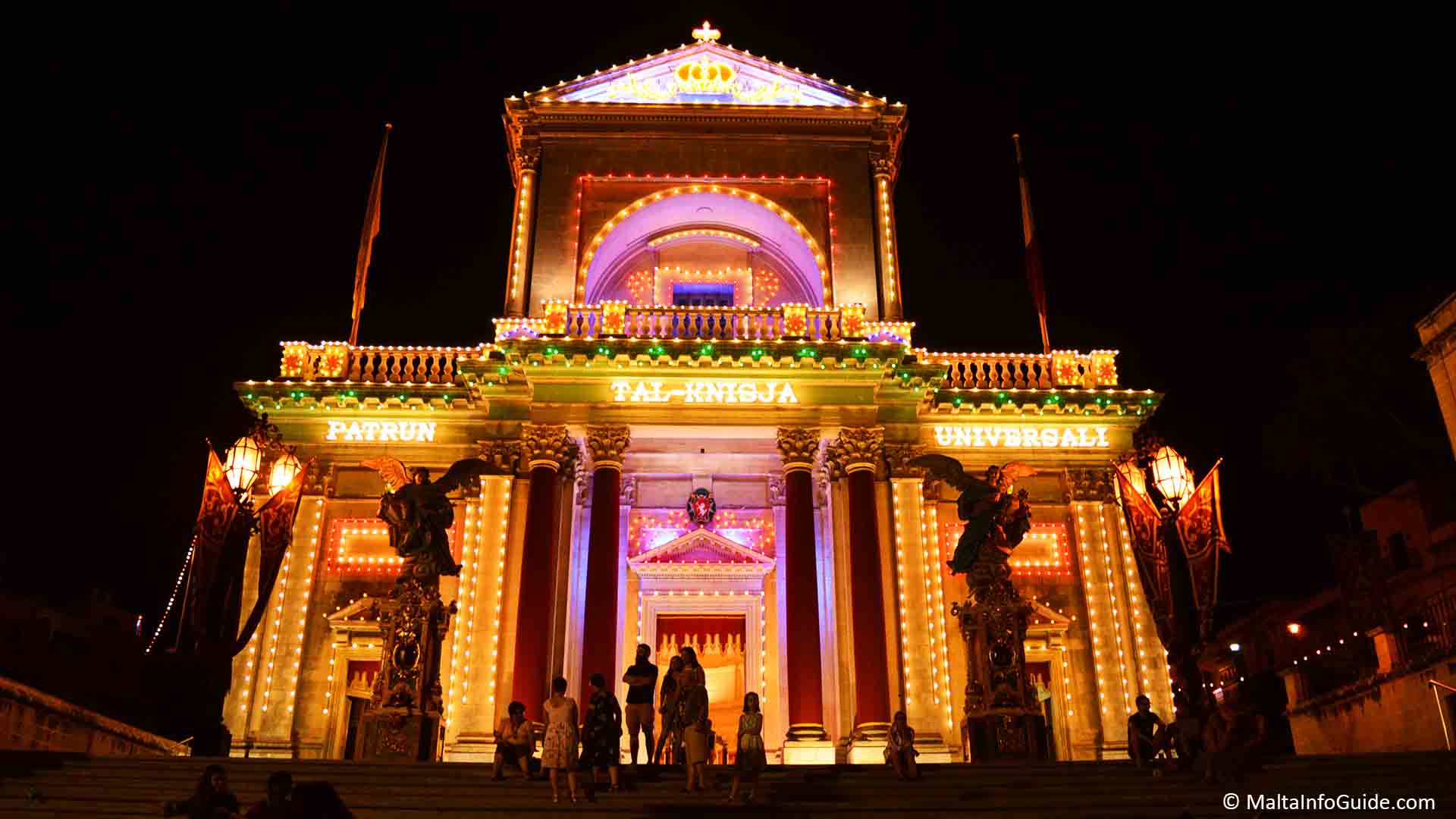 Kalkara Malta church decorated and lit up at night on the night of the feast day