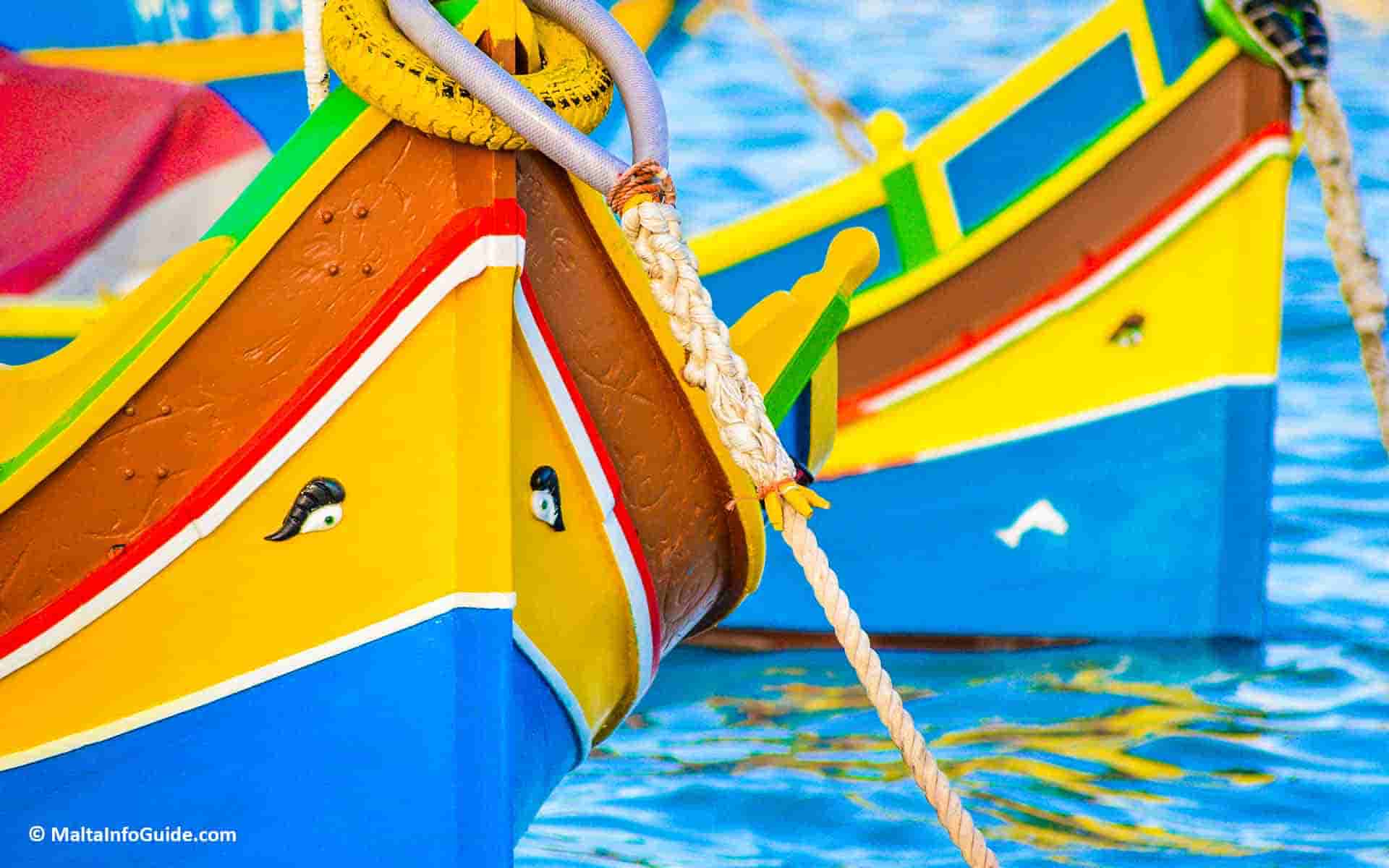 The beautiful 'luzzu' boats moored at Marsaxlokk fishing village.