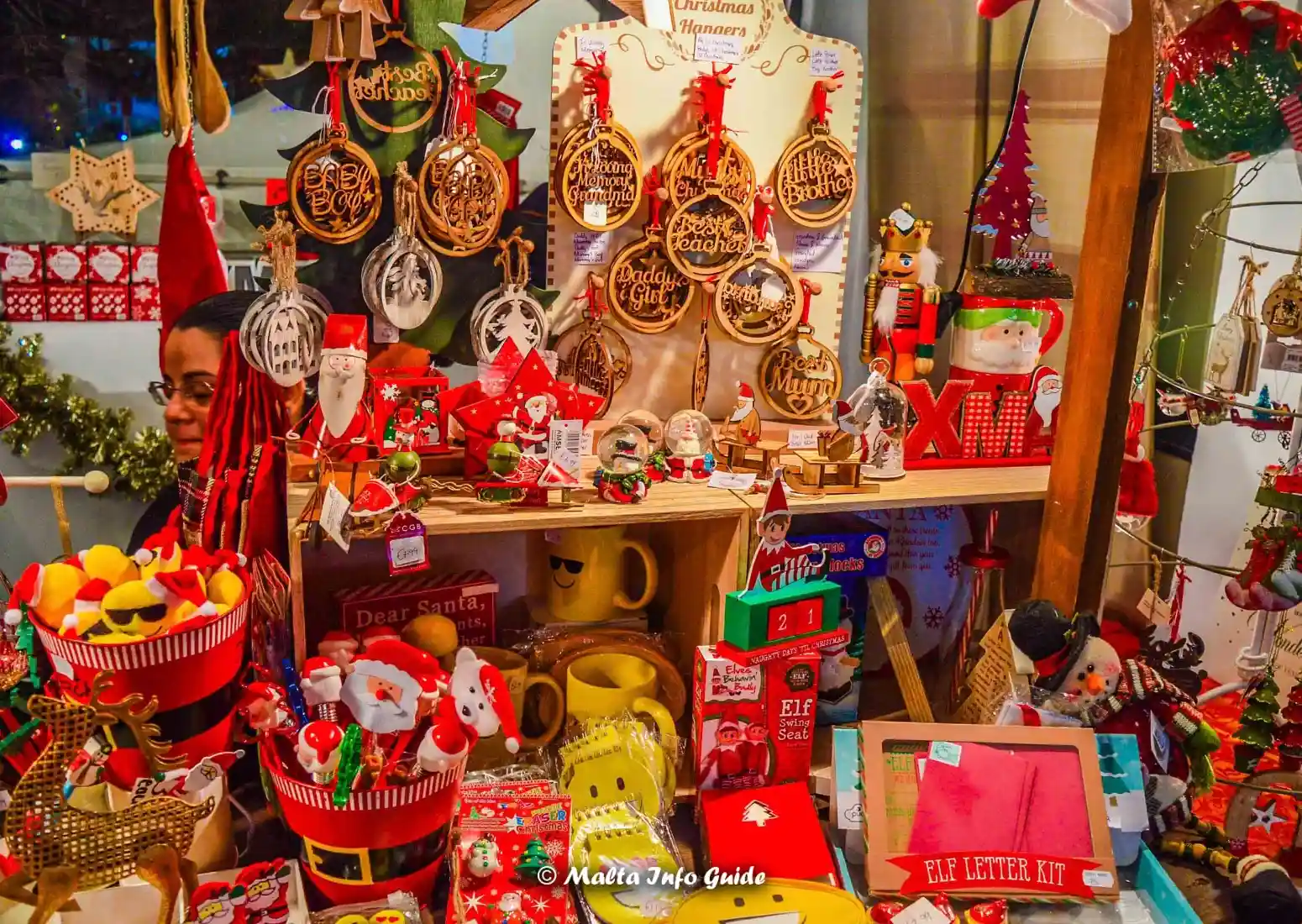 Colourful Christmas ornaments displayed at a Malta market stall.