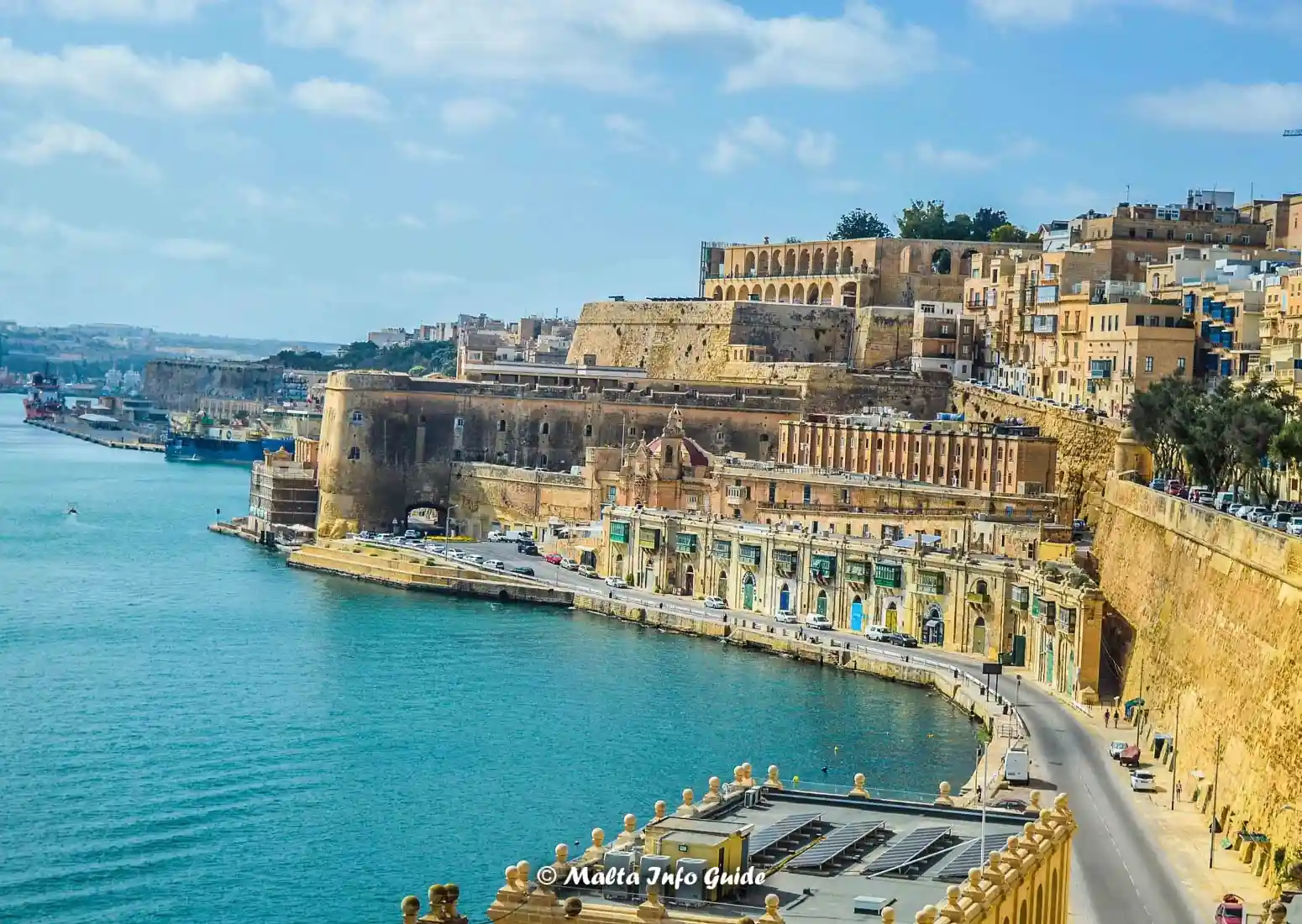 Fortified Grand Harbour waterfront under bright November sunshine.