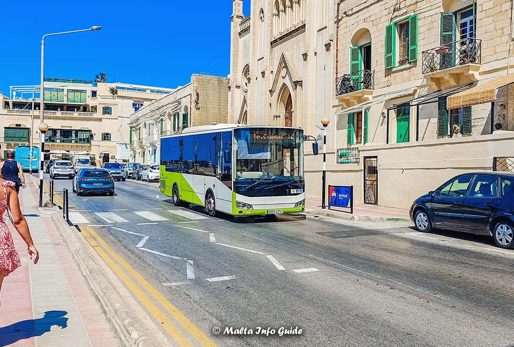 Malta public transport bus driving through Balluta.