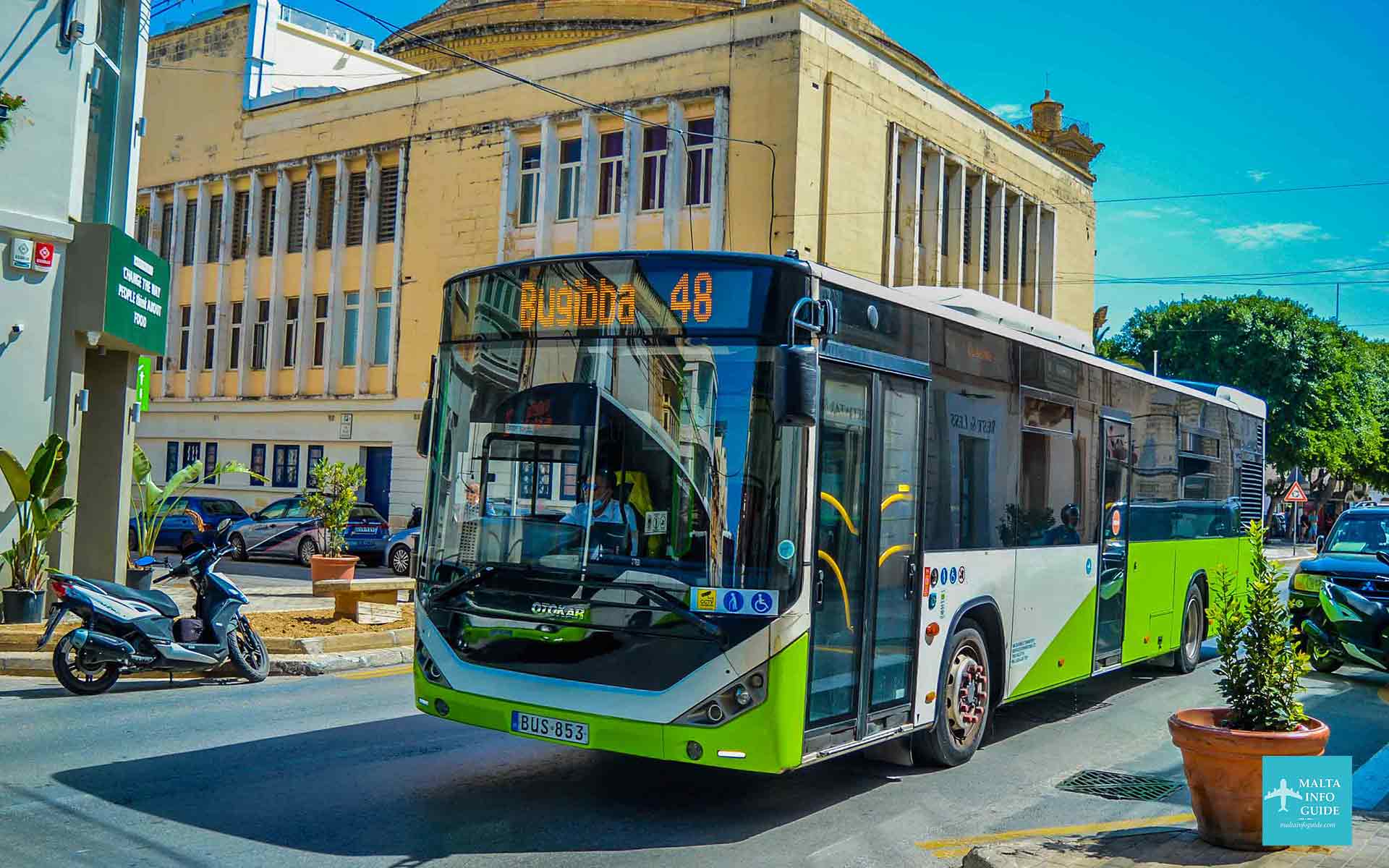 A bus passing through Mosta street.