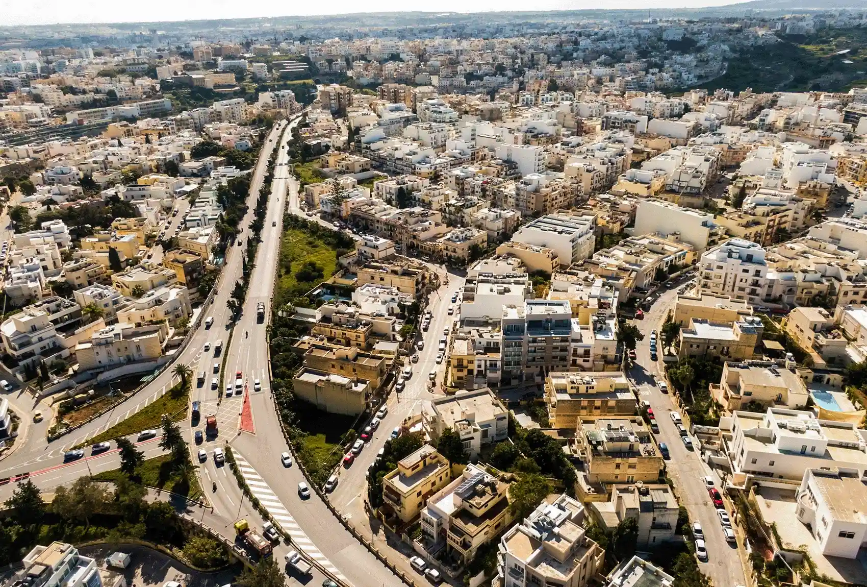 Aerial view of roads through a Maltese town.
