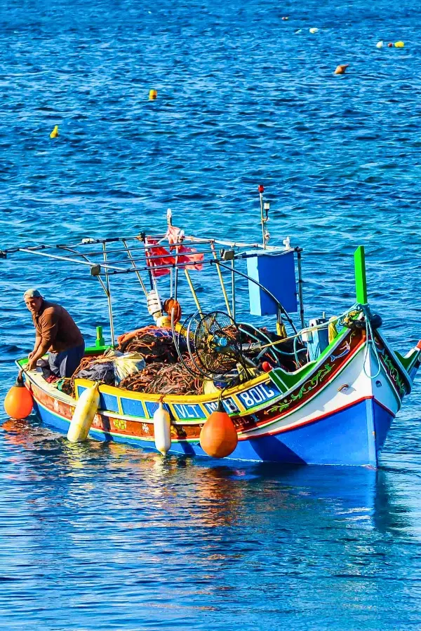 A local on a Kajjik boat in the middle of the Mediterranean sea.
