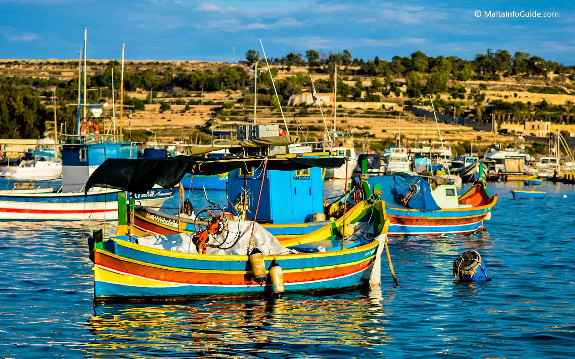 Luzzu boats moored at Marsaxlokk fishing village.