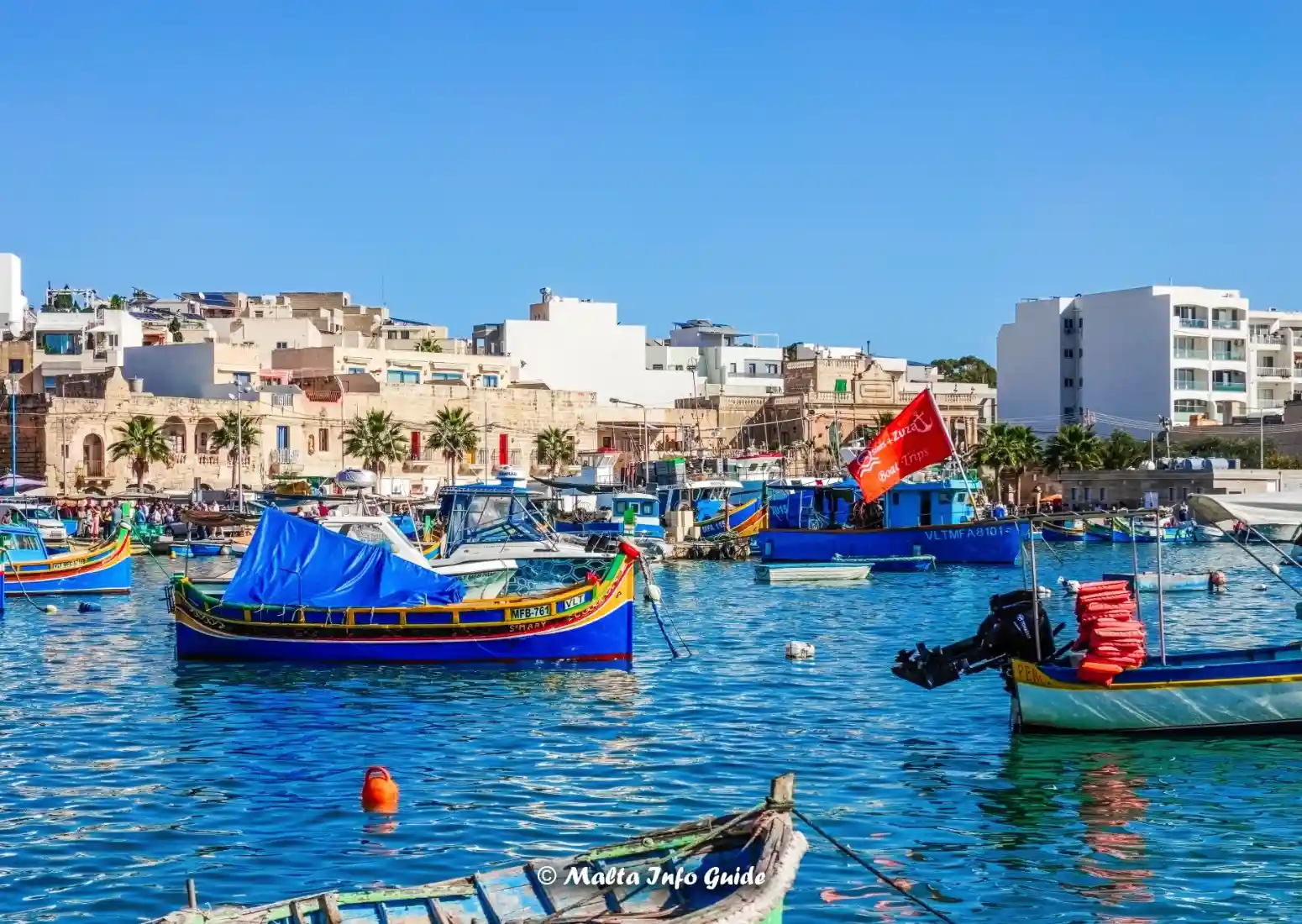 Colourful Maltese boats in Marsaxlokk harbour.
