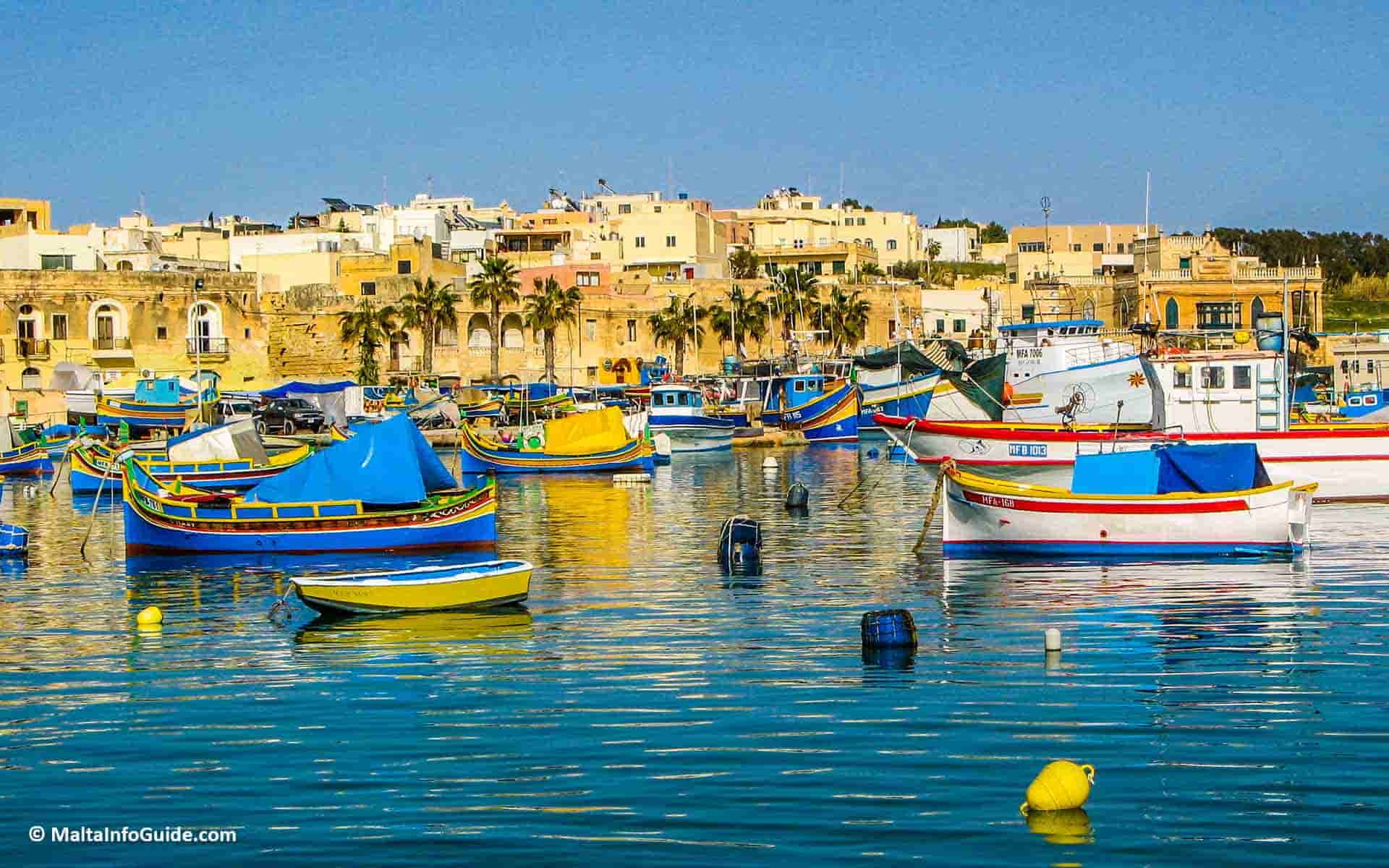 General view of the fishing boats anchored at Marsaxlokk Malta.