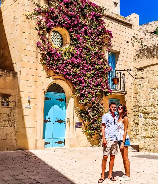 A couple posing infront of the famous Instagram hotspot in Mdina.