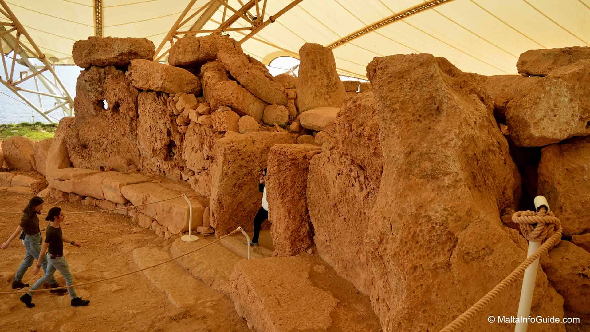 People walking in the Mnajdra temples.