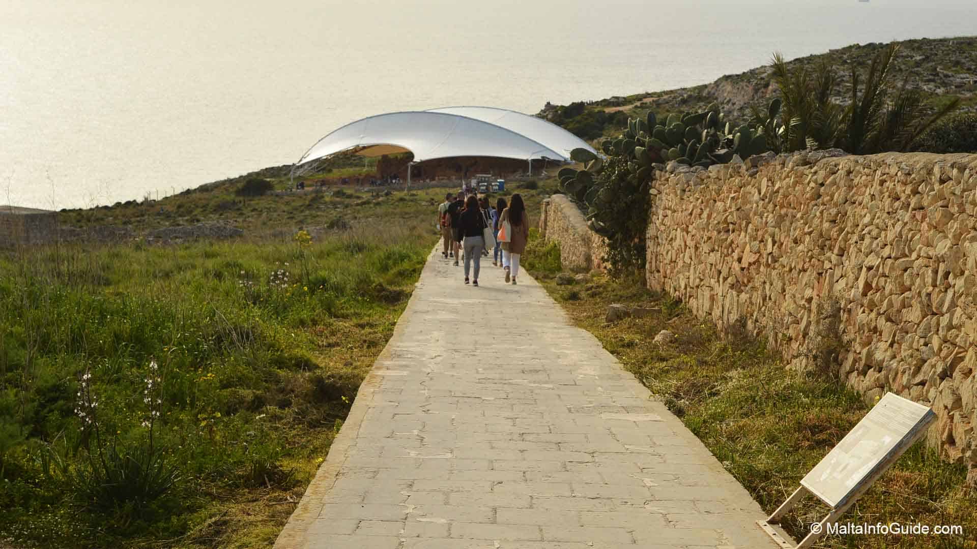 People walking down the passage way to Mnajdra Temple
