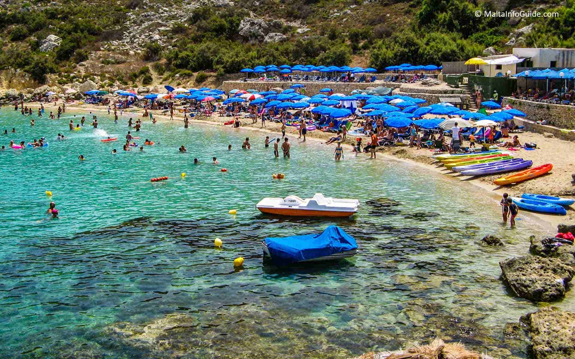 People swimming at Paradise bay beach Malta
