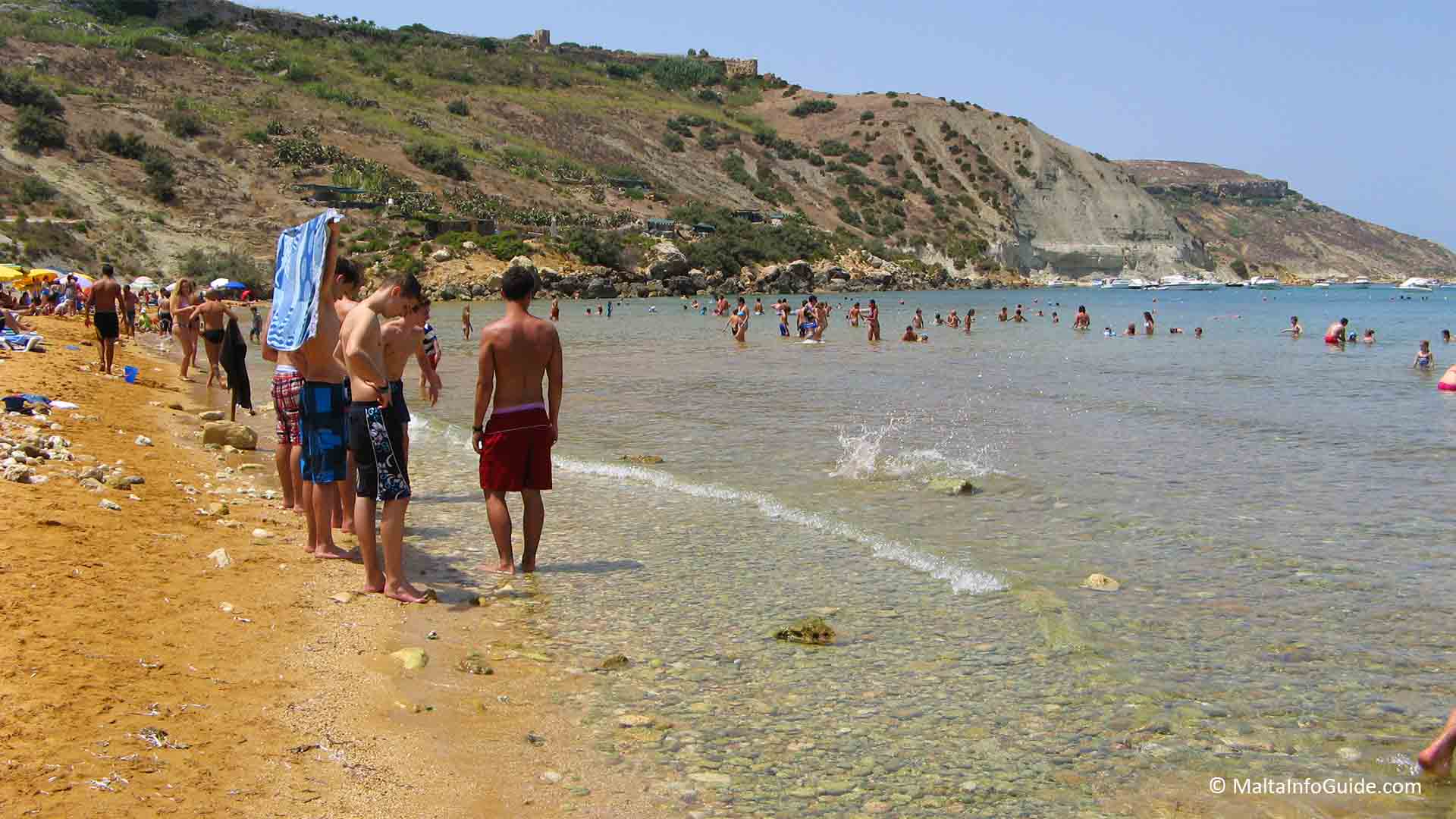 Youngsters enjoying the day at Ramla Bay Gozo.