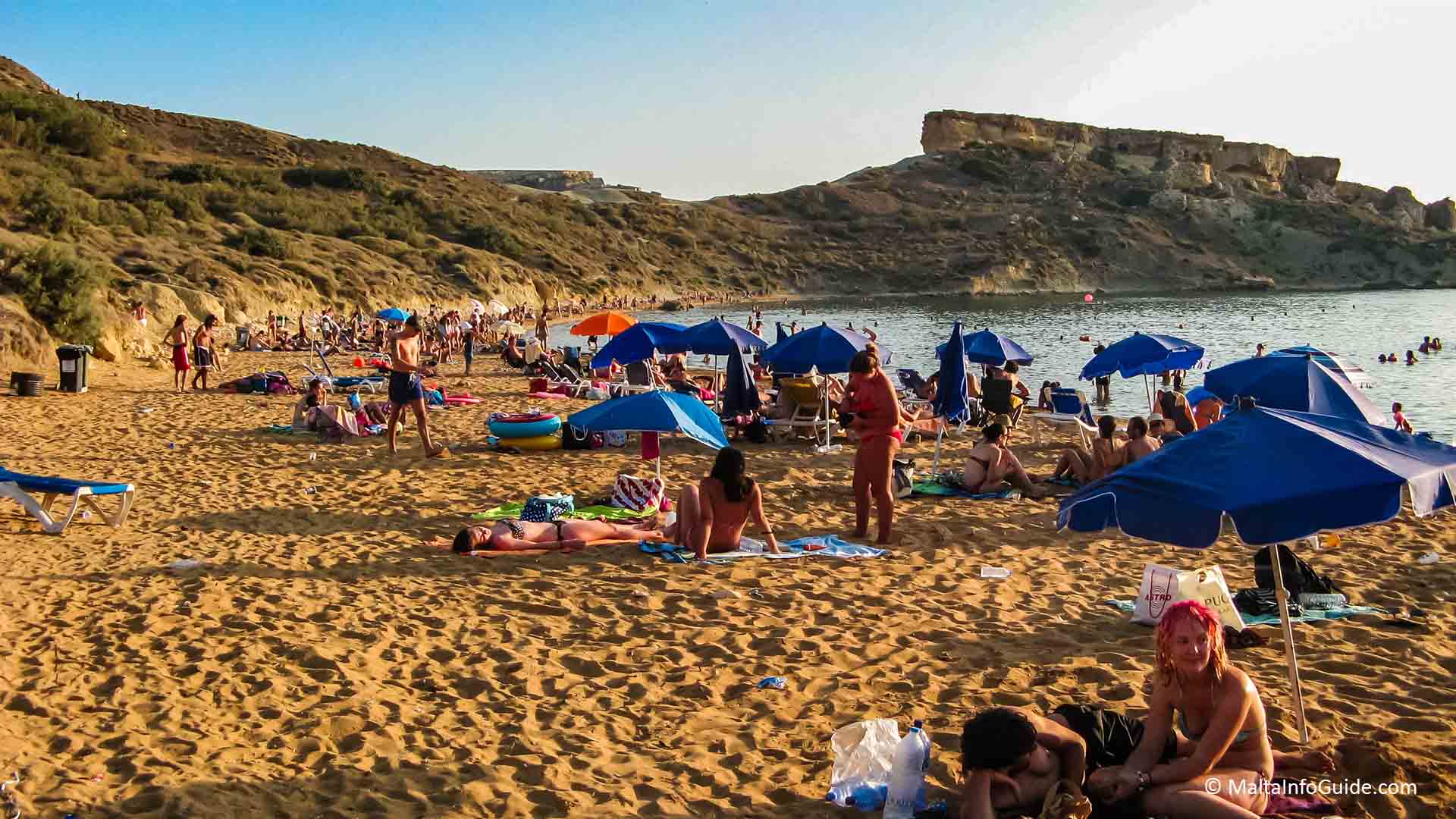 People sunbathing at Ghajn Tuffieha Malta