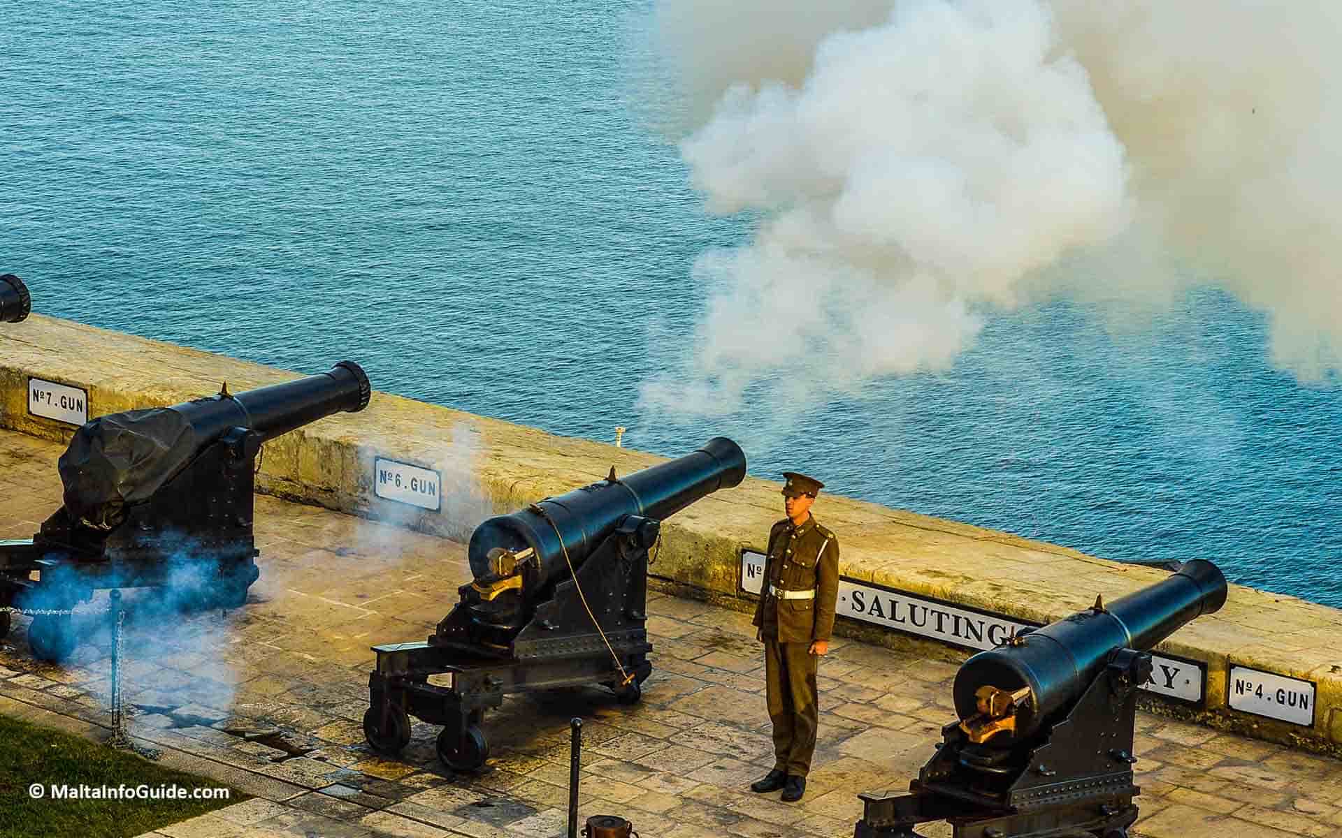 The saluting battery being fired at noon. The saluting battery being fired at noon.