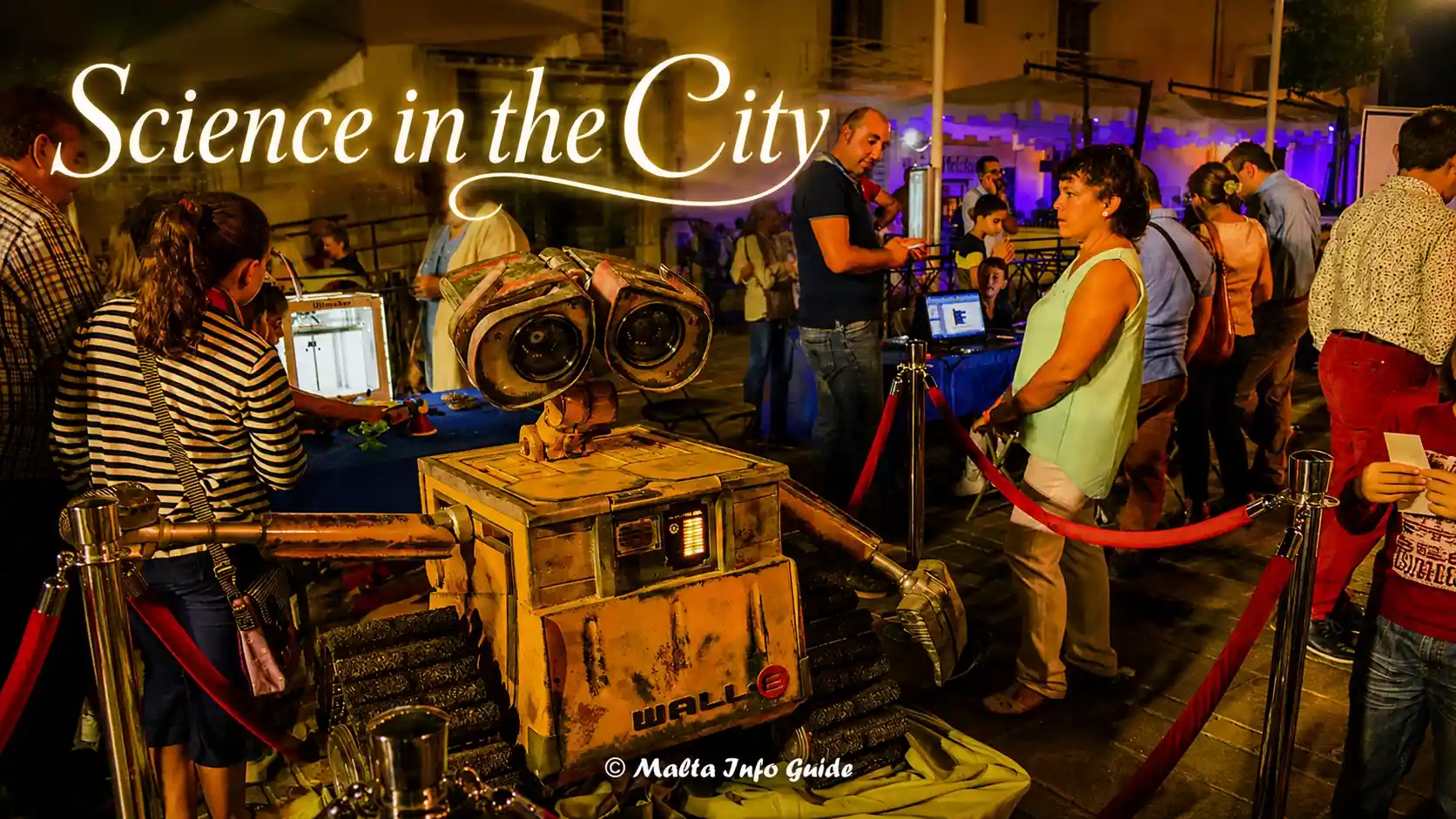 Visitors explore a robot exhibit at Science In The City.