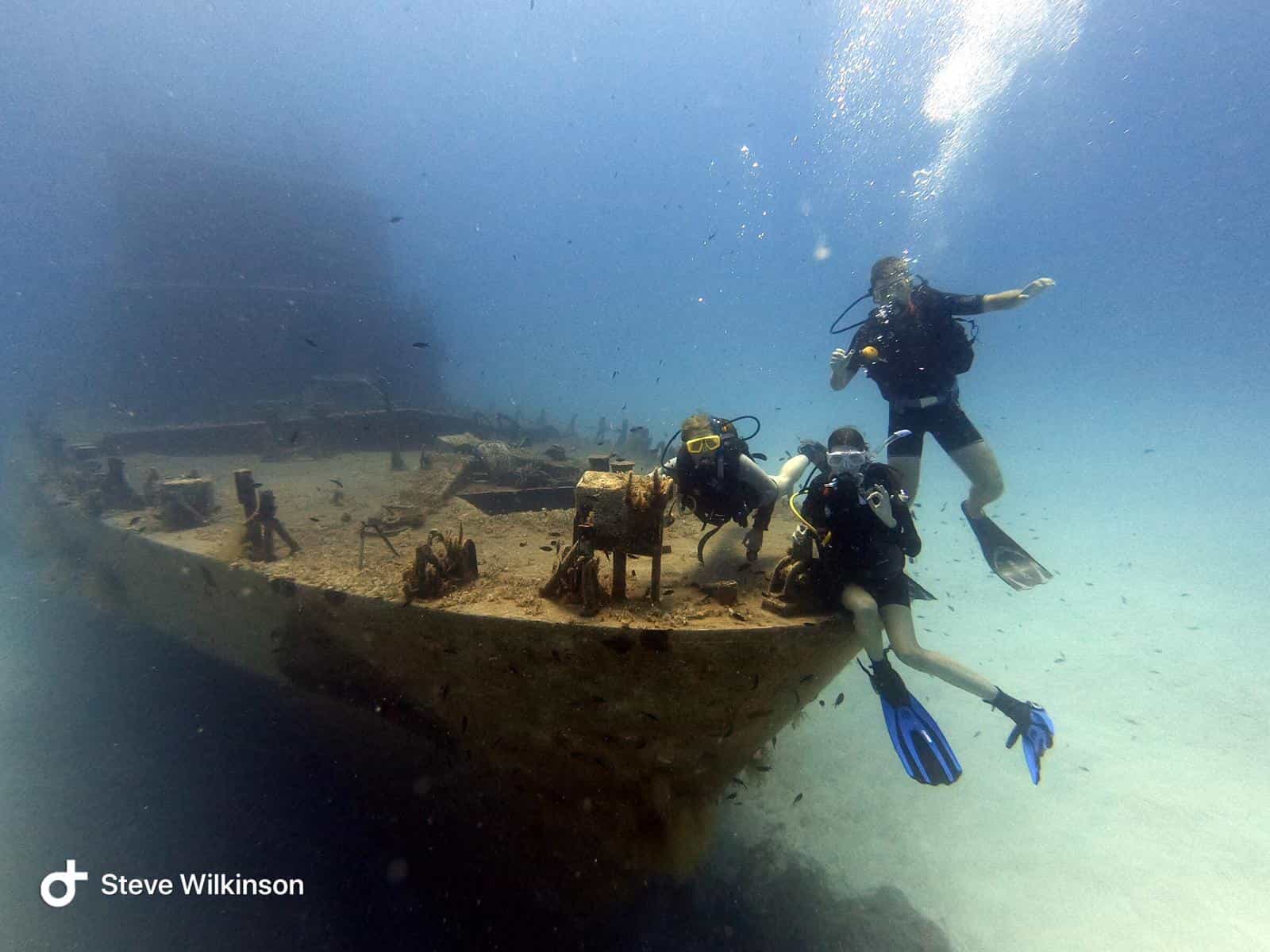 A group of scuba divers at one of Malta's shipwrecks
