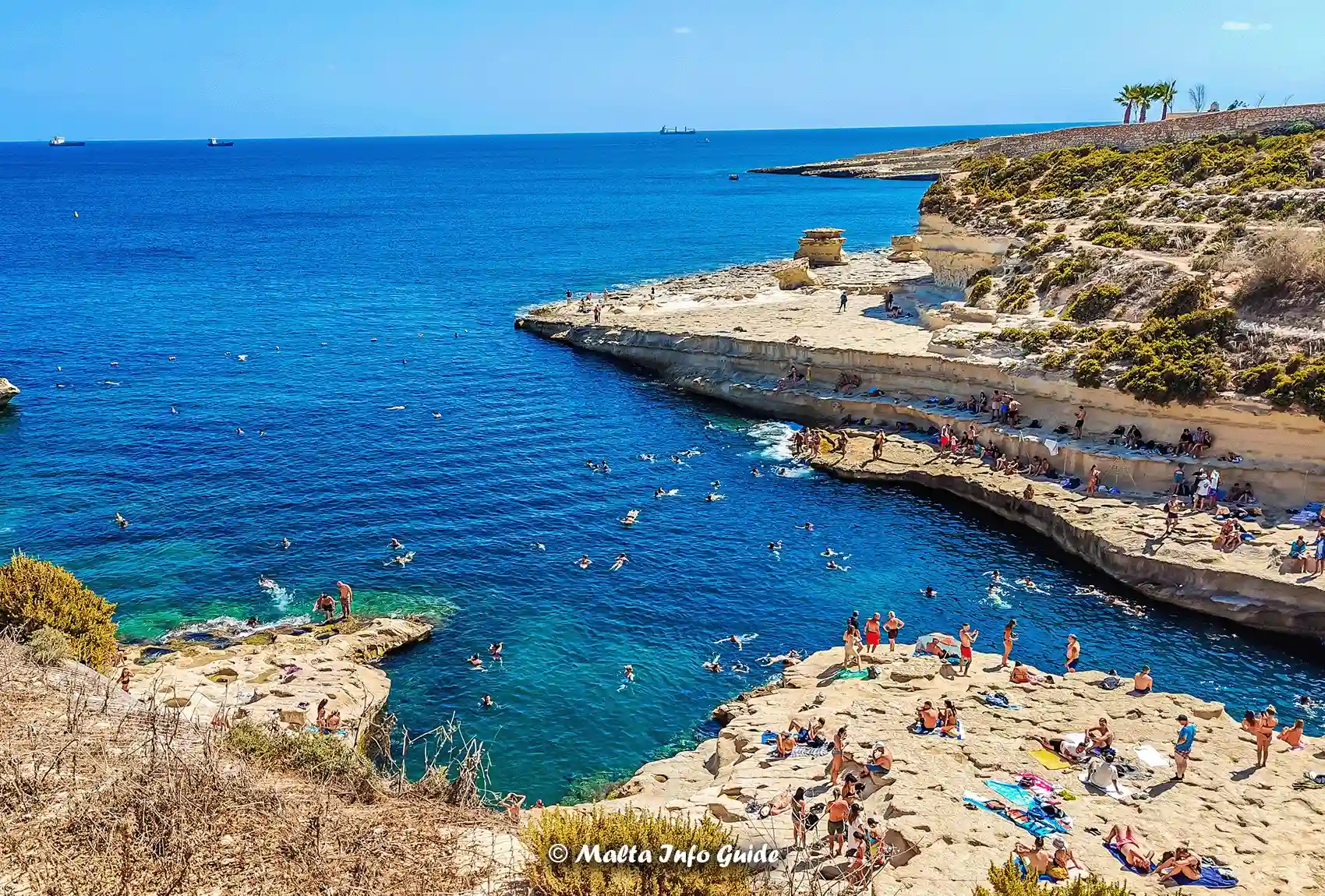 Swimmers and Divers at St. Peter’s Pool in Malta.